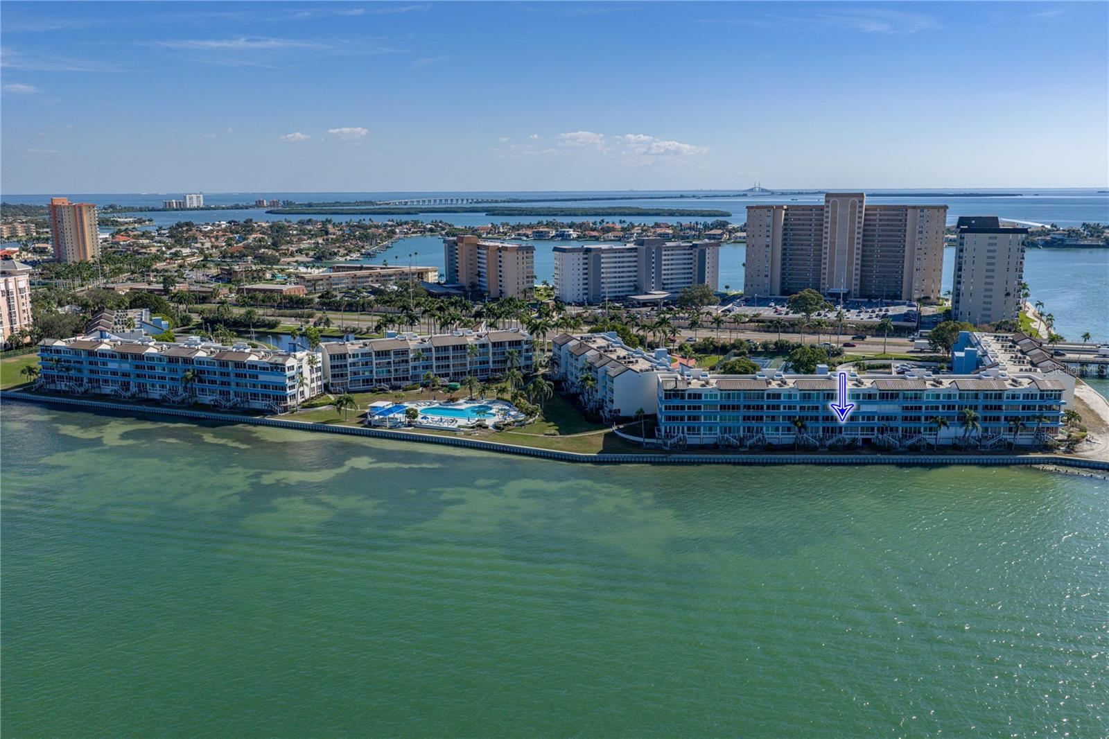 Aerial showing Building and location of unit close  proximity to pool