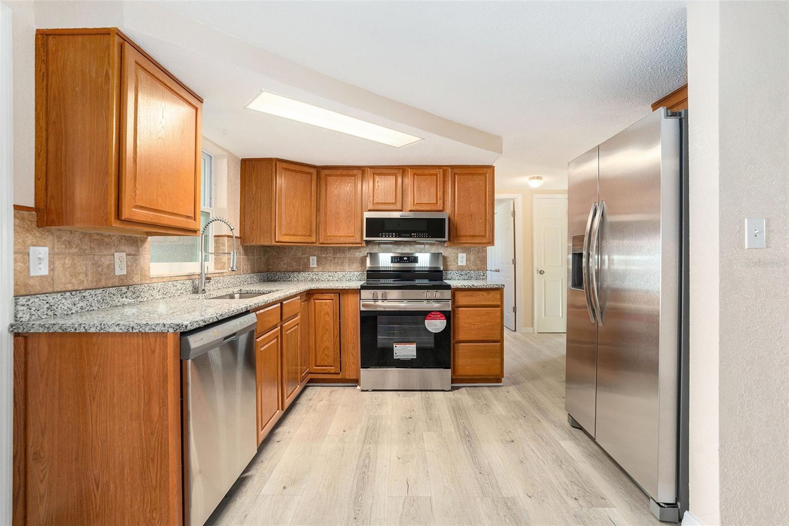 Brand new granite counter! Brand new stainless steel appliances, floors, cabinets!