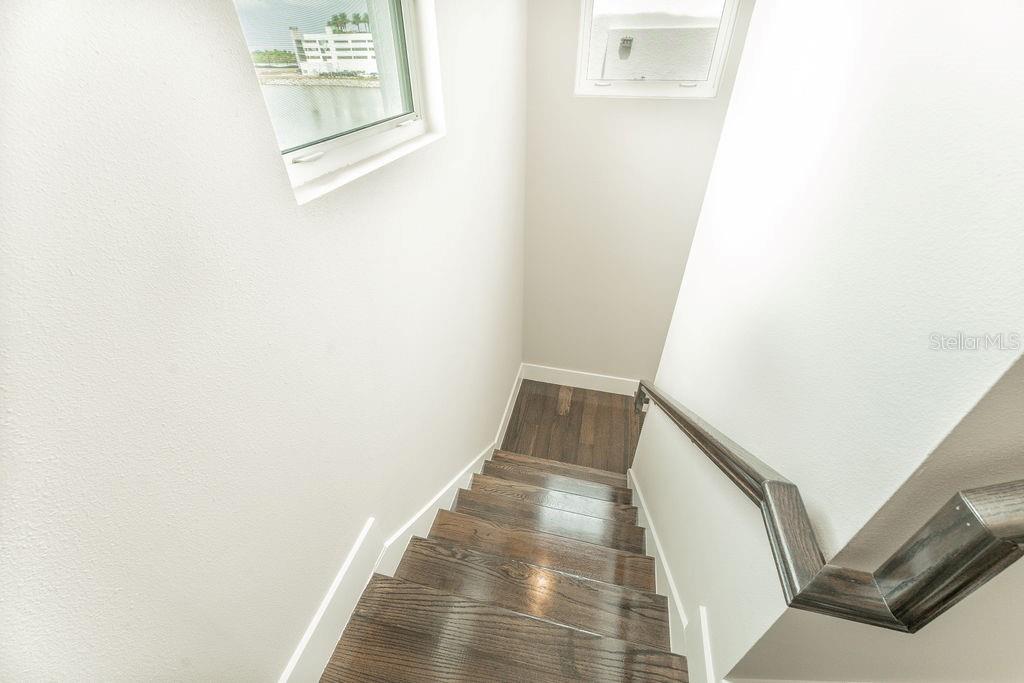A staircase leading up to the roof deck.