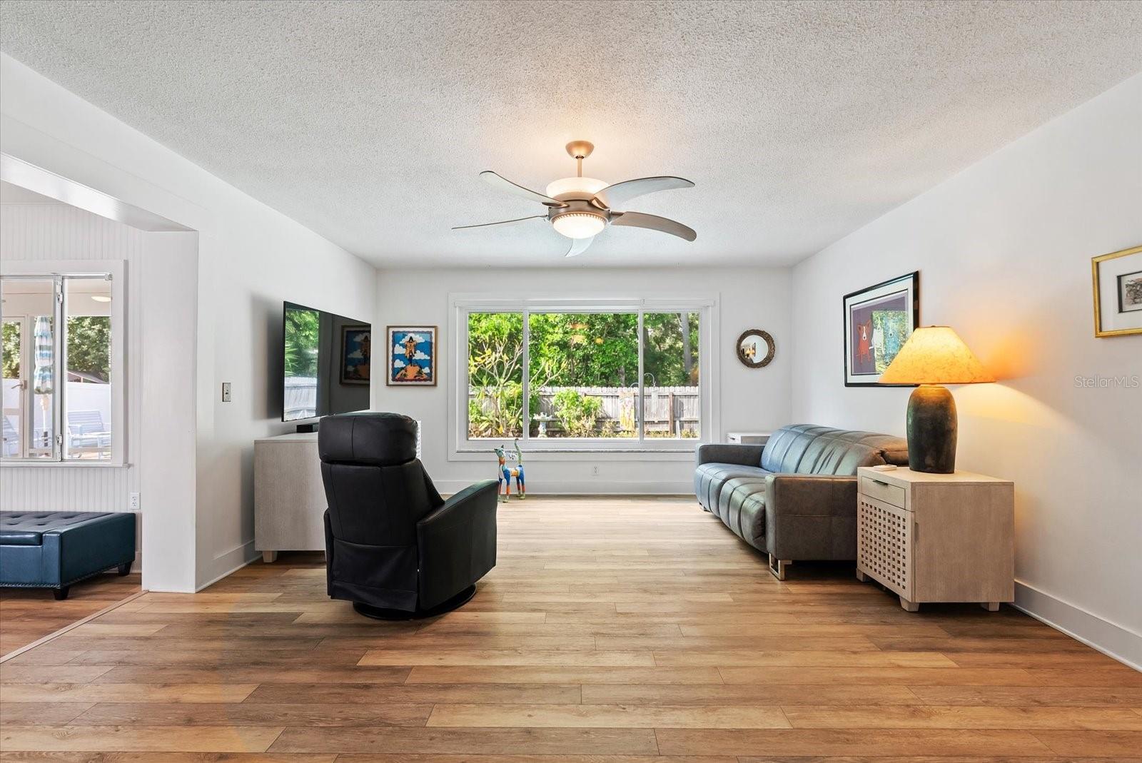Picture window in Living Room overlooking pool and Hammock Park