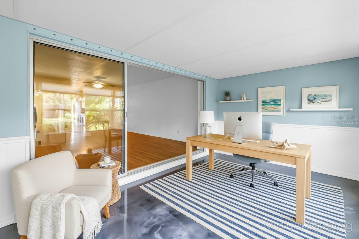 Virtually Staged/ designed sun room as an office.