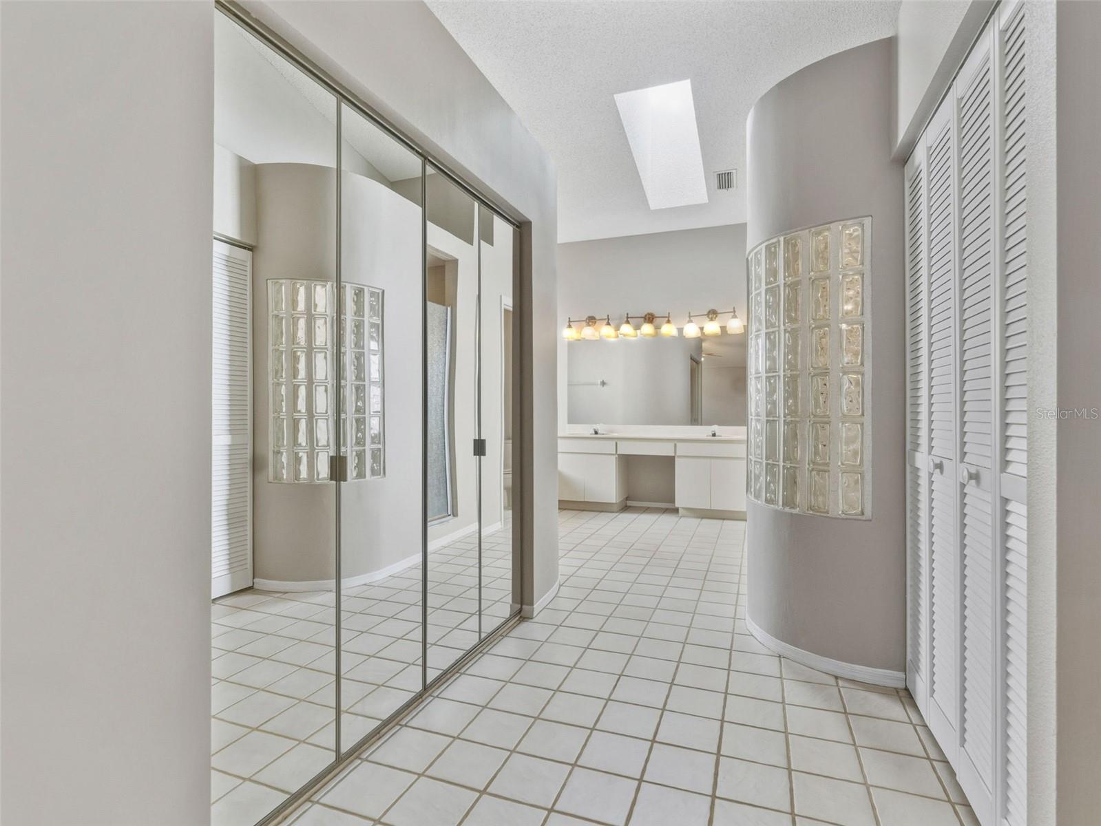 Primary bathroom, HUGE walk in closet to left