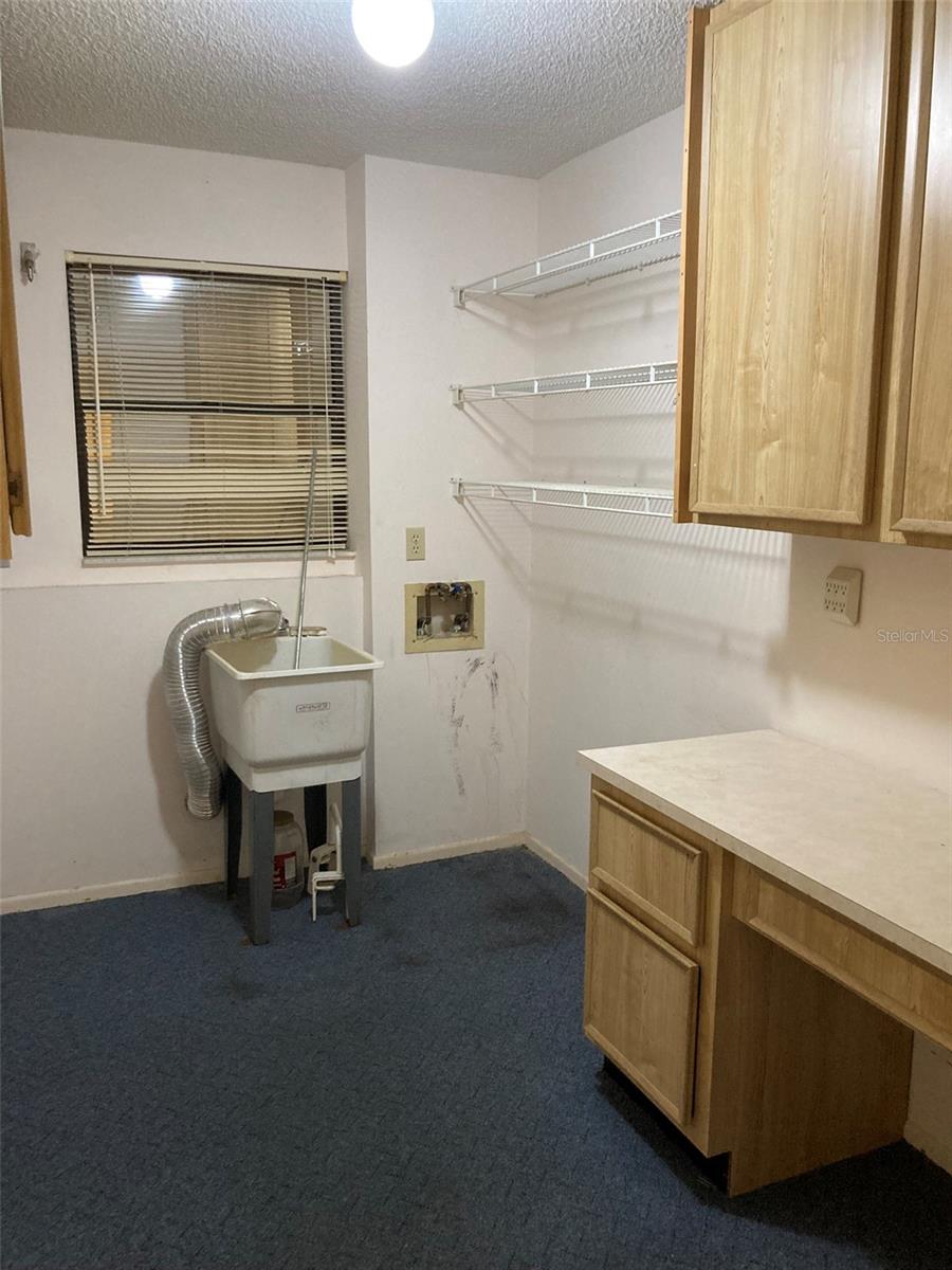 Large laundry and storage room off the kitchen