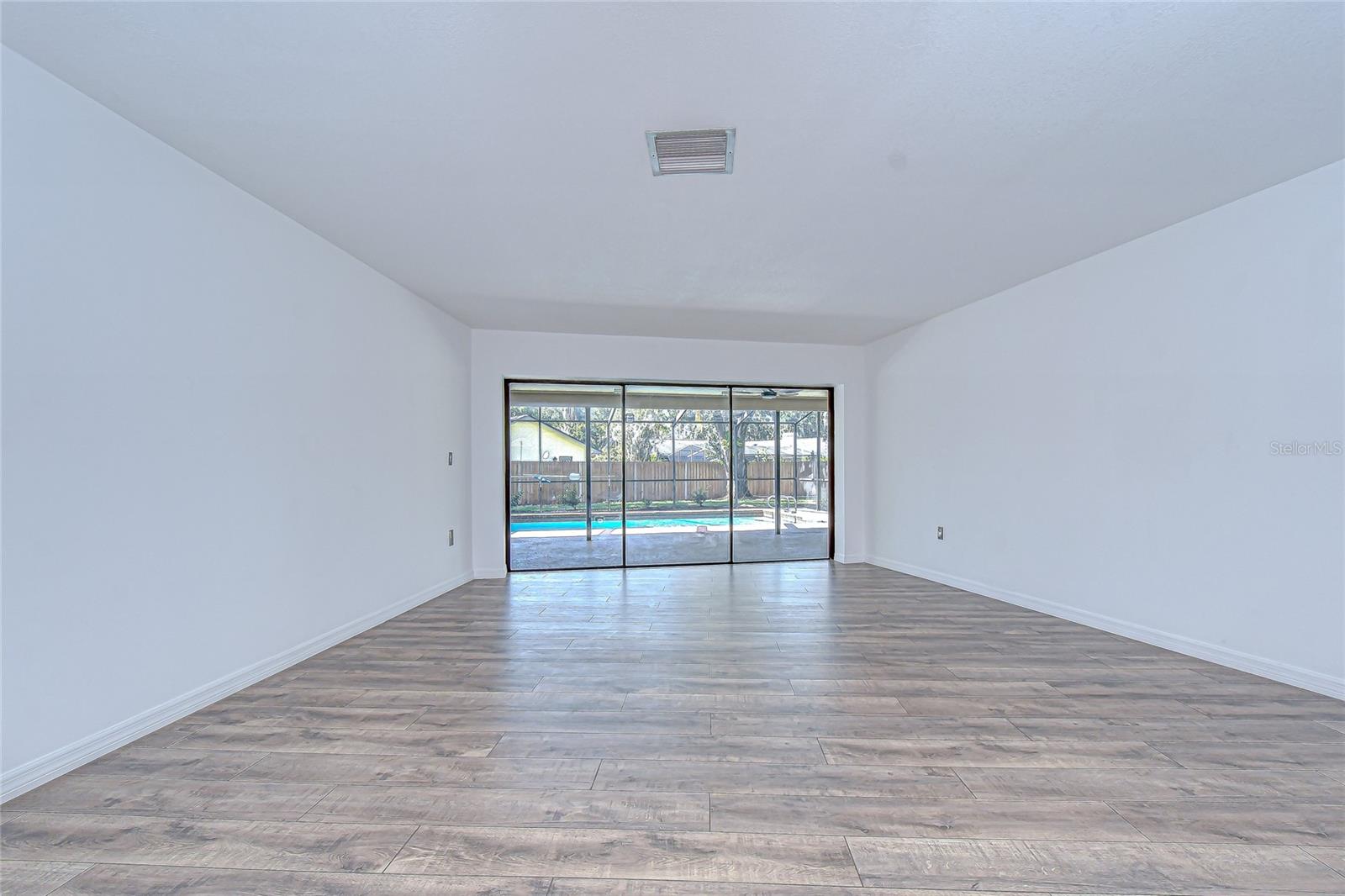 Formal living room with sliders to lanai!