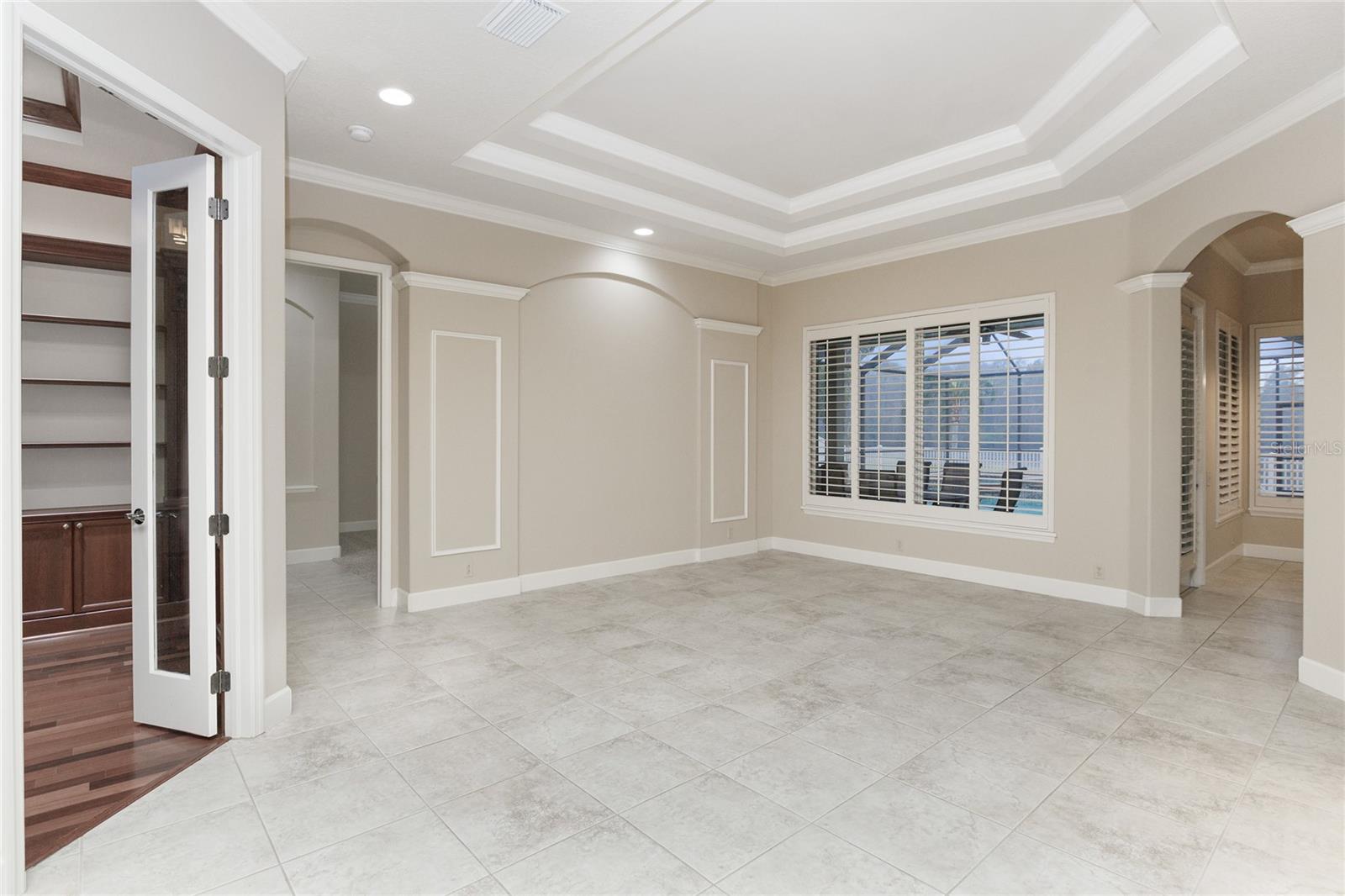 Formal living room coffered ceilings and crown molding
