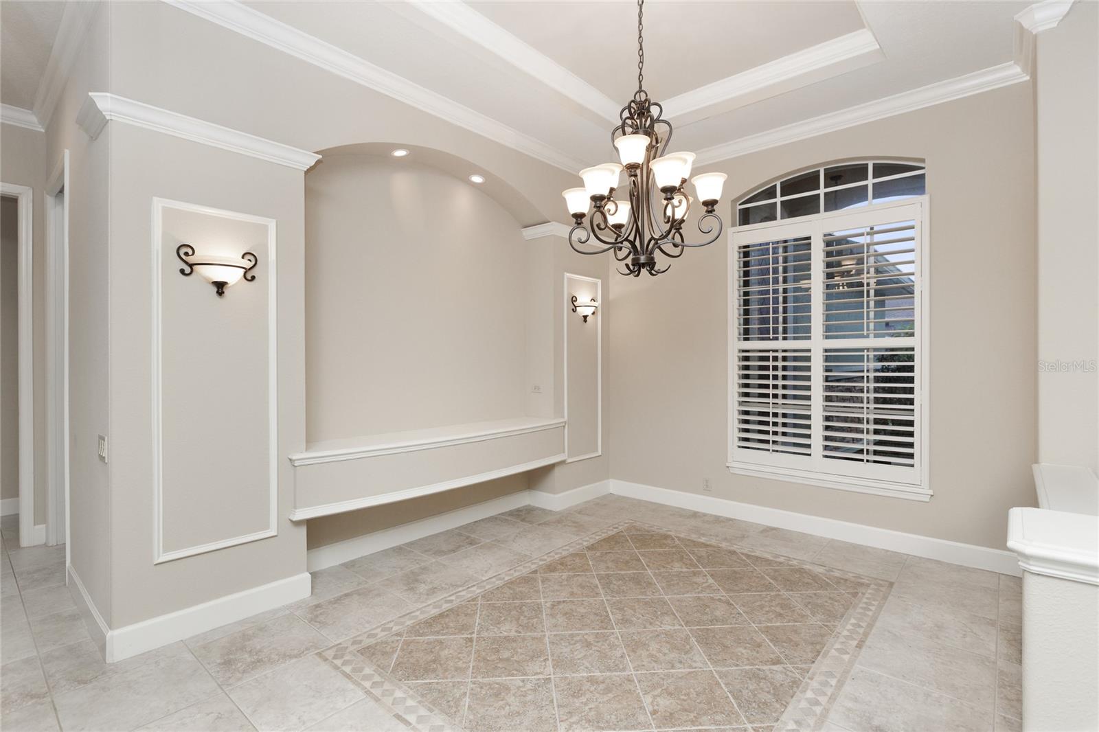 Formal Dining Room with coffered ceilings and crown molding