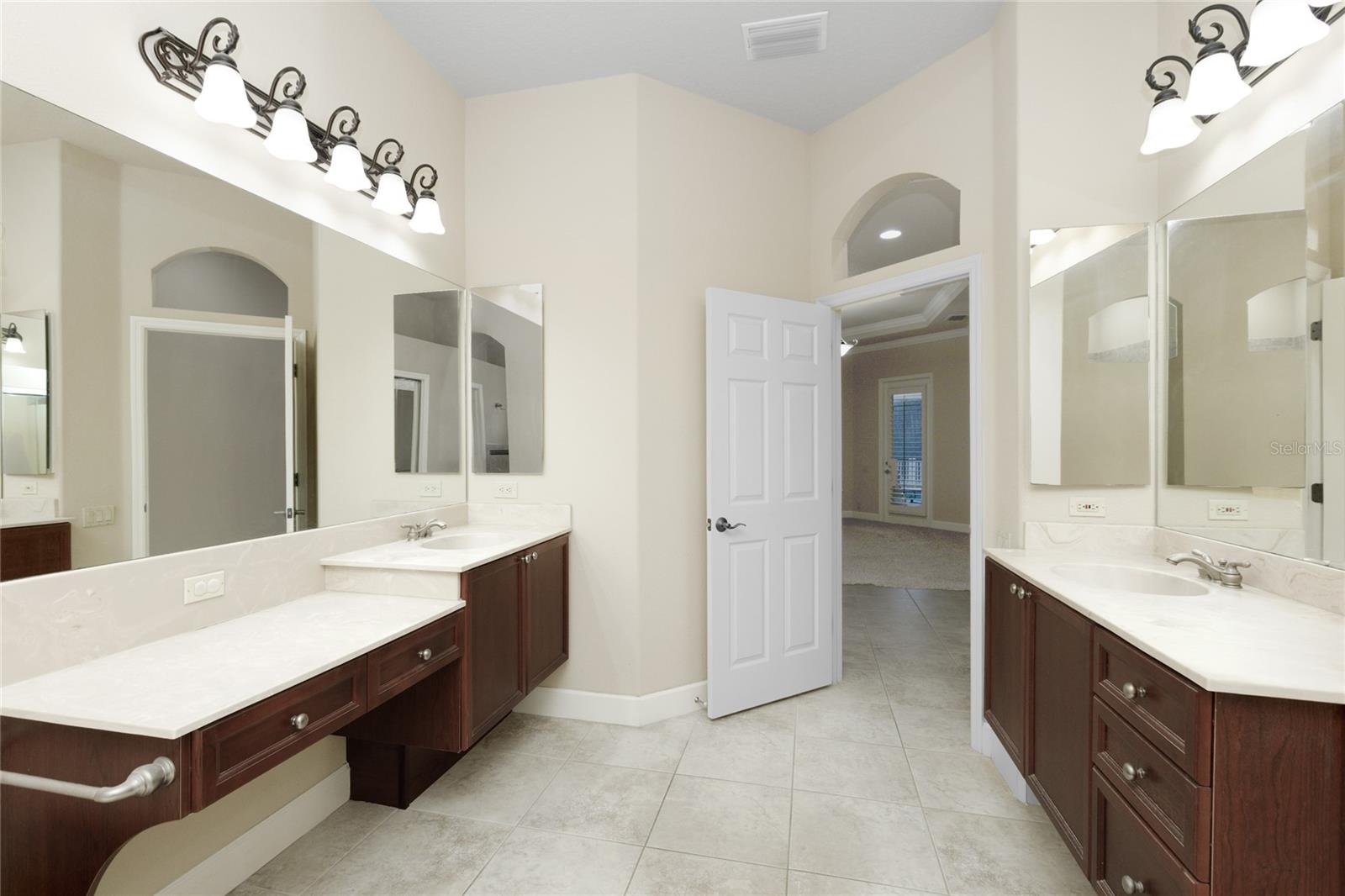 Master Bathroom with double sinks, garden tub and plantation shutters