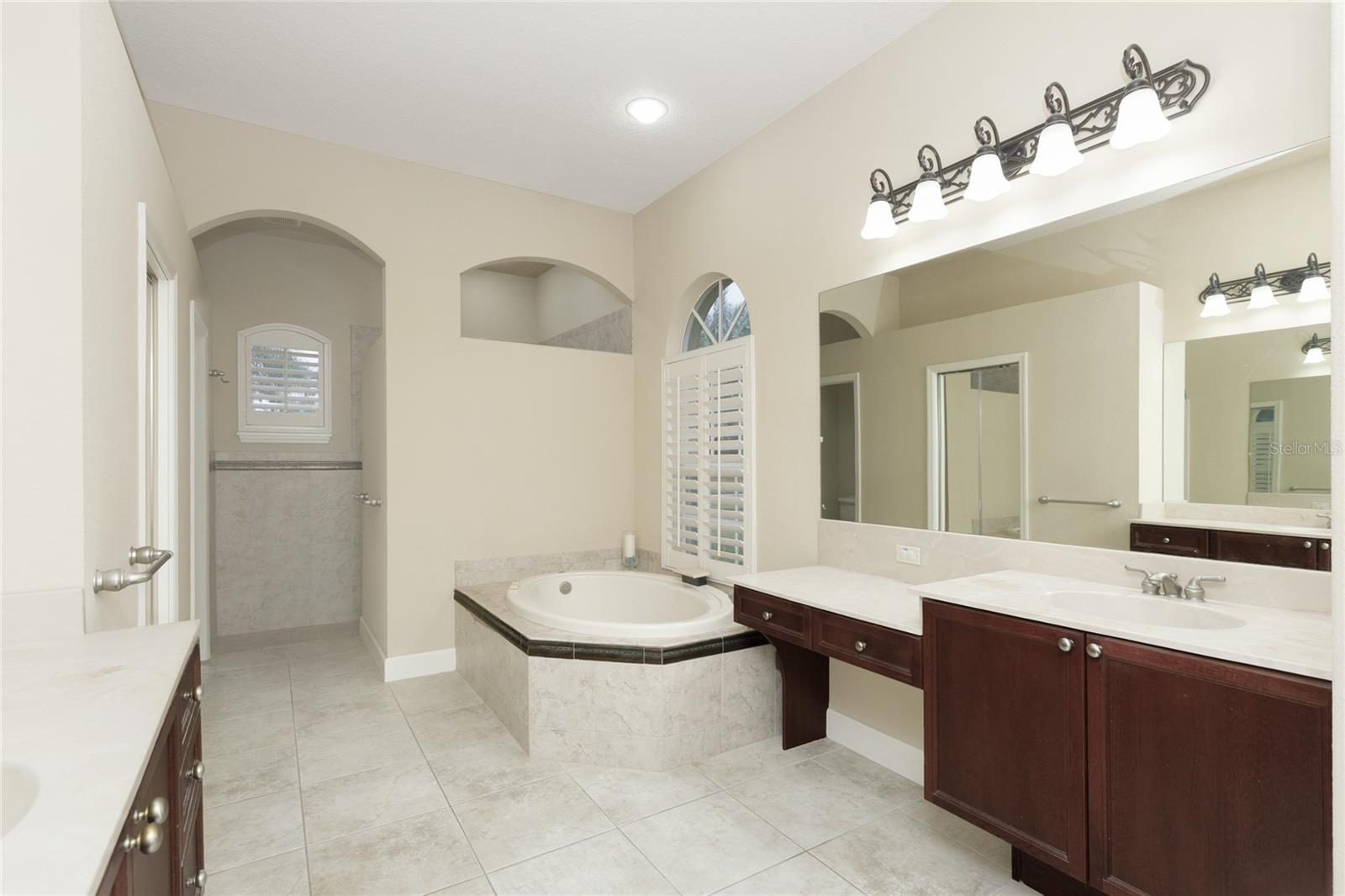Master Bathroom with double sinks, garden tub and plantation shutters