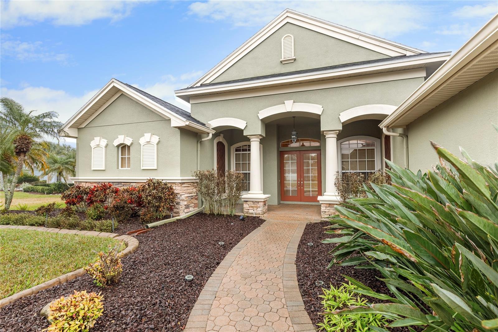 Pavers, rubber mulch and landscaping at entrance