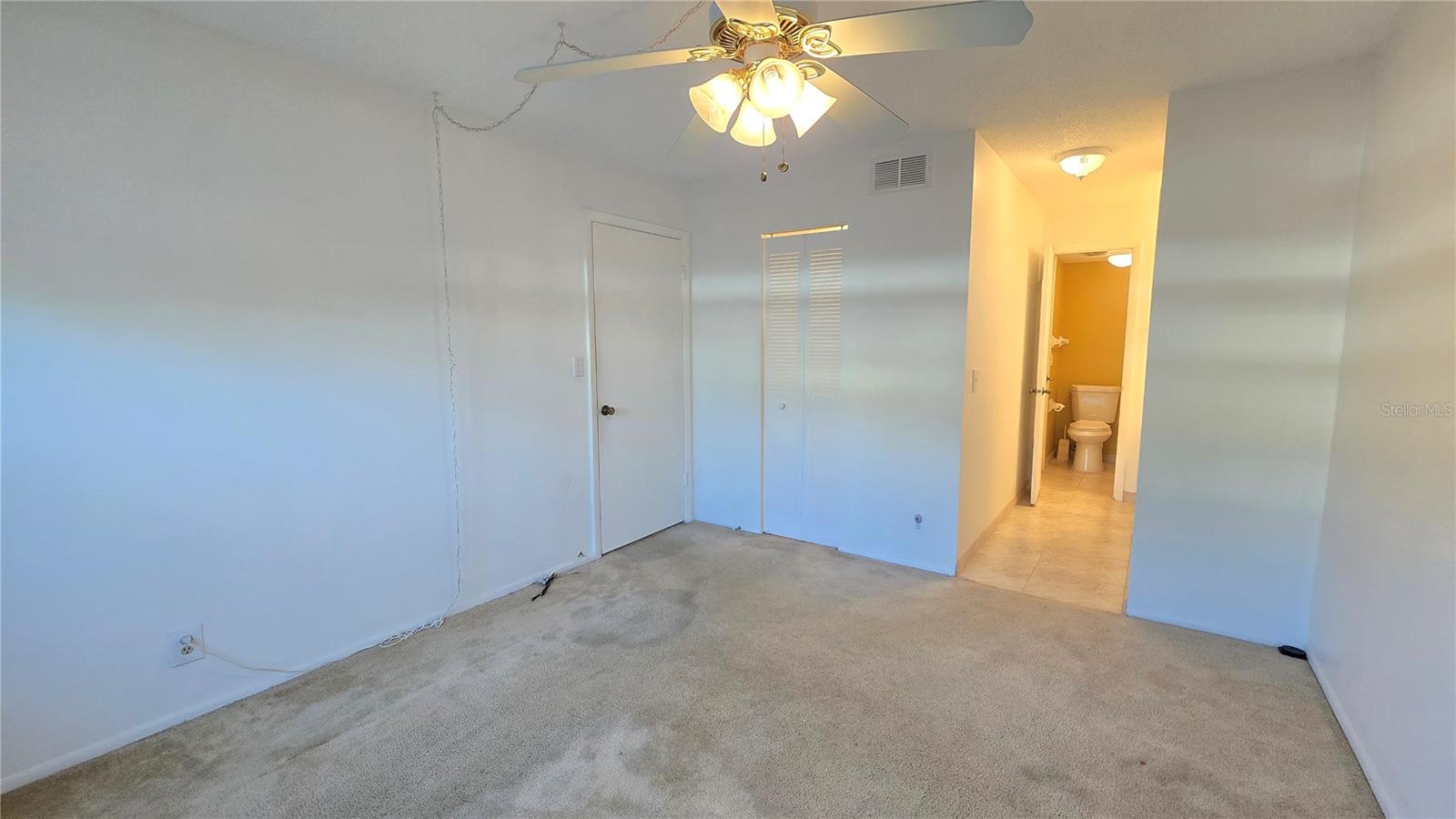 Primary Bedroom with a full bathroom with shower/tub combo.