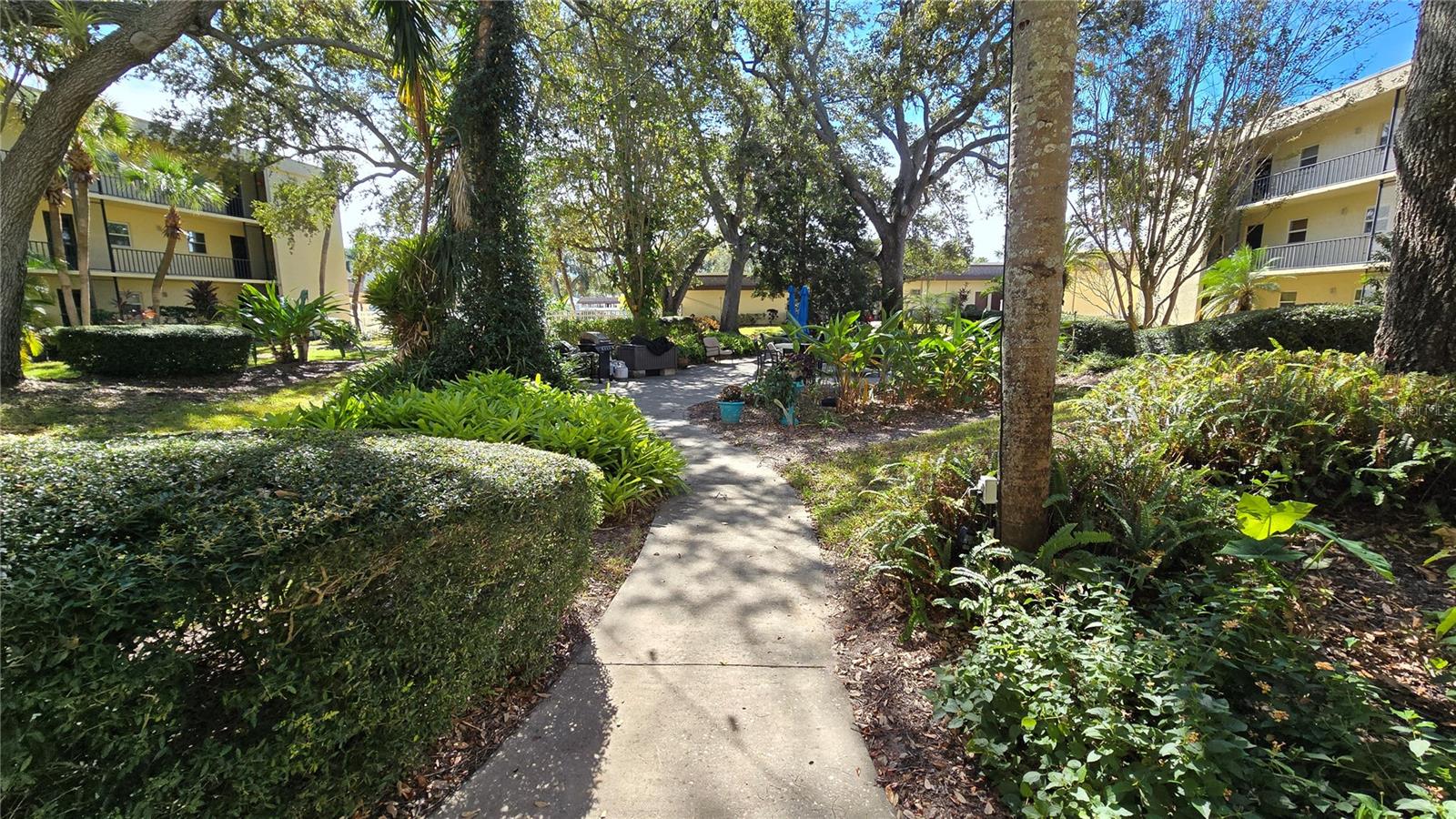 Walk way that leads to the community clubhouse as well as the pool/spa area.