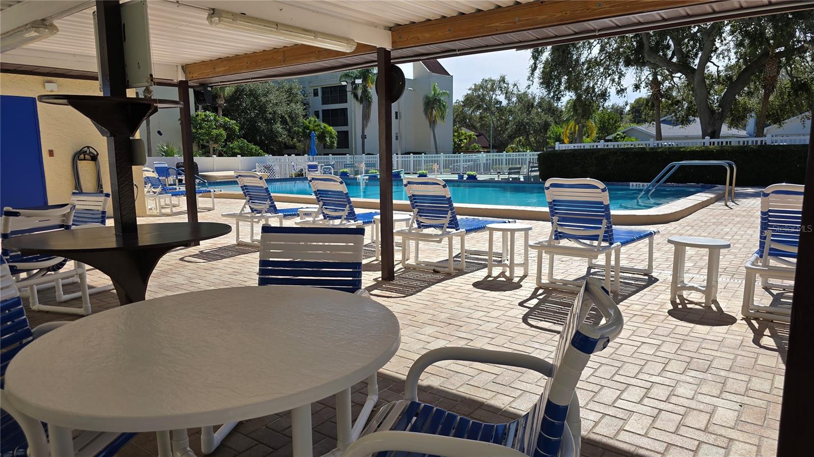 Covered area in the pool area to sit and relax.