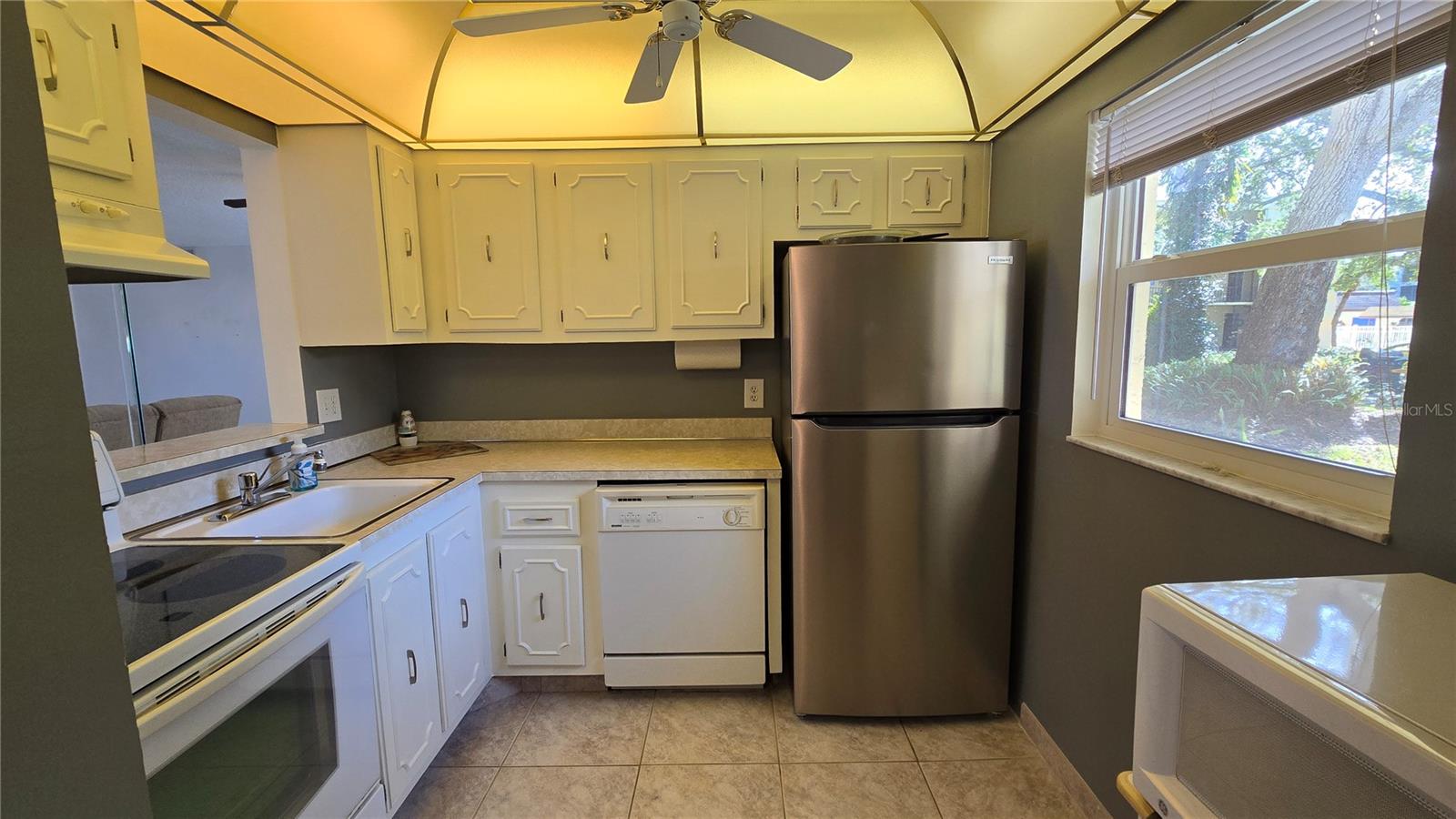 Kitchen with pass through to the dining room.