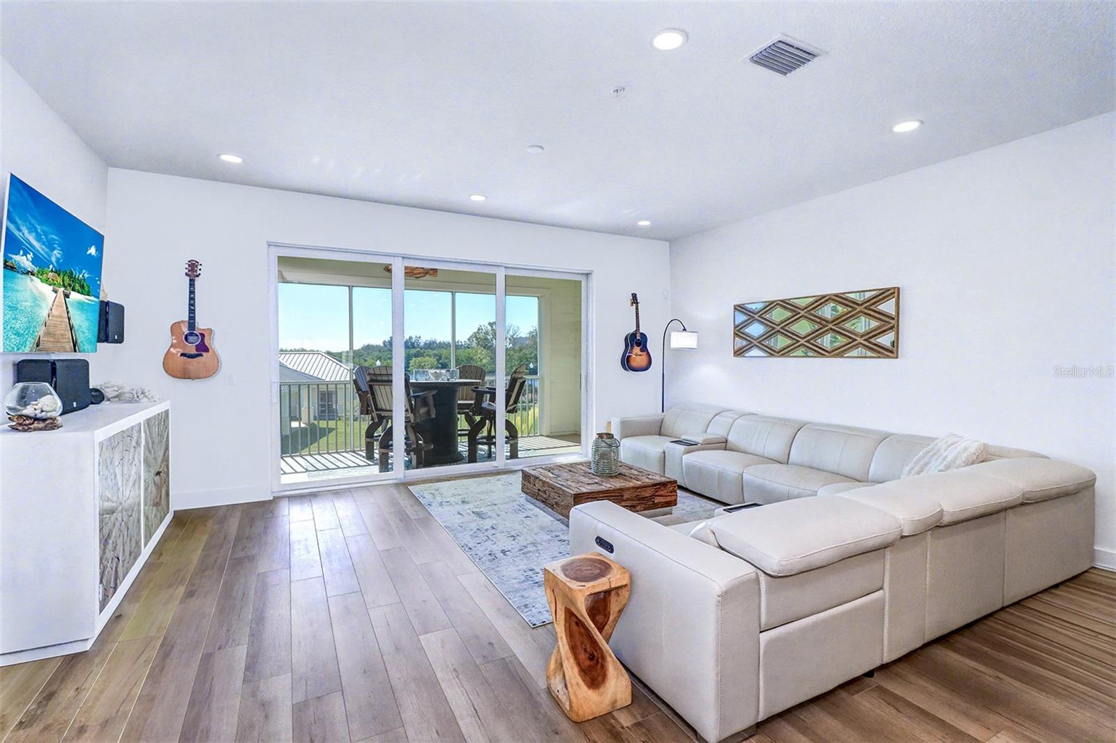 Living Room with balcony and water view
