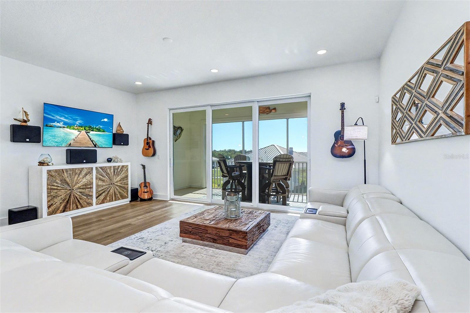 Living Room with balcony and water view