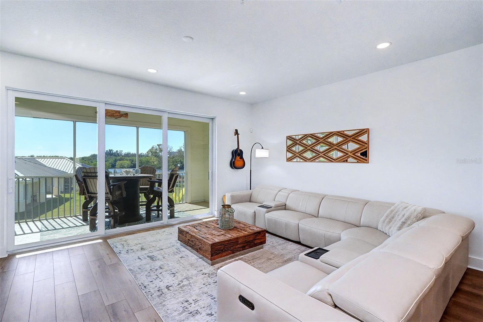 Living Room with balcony and water view