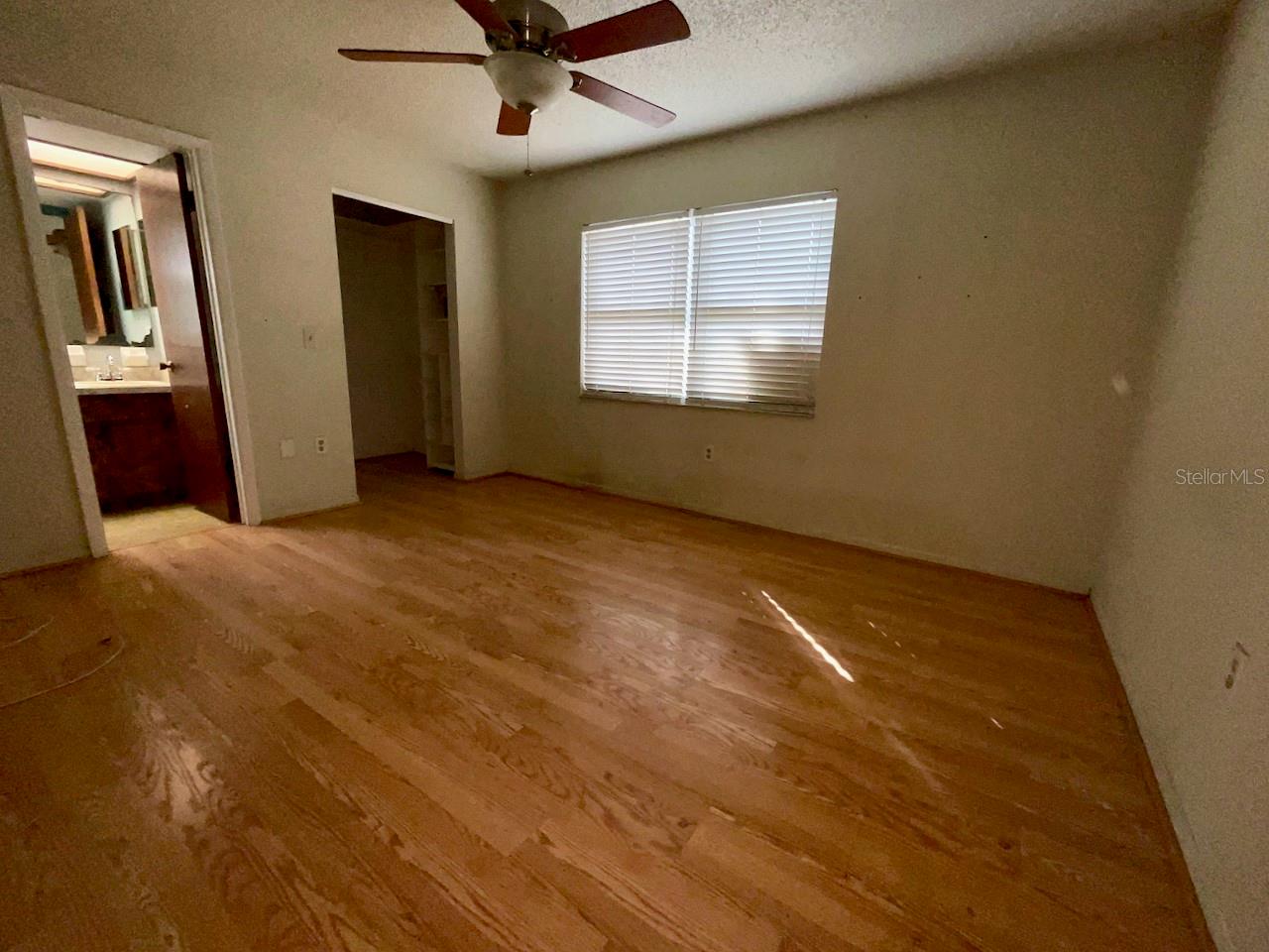 11-Primary Bedroom with bathroom and walk-in closet