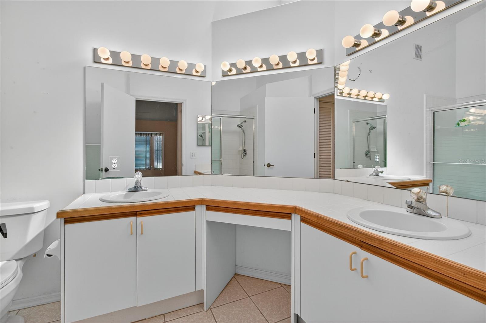 Primary bathroom with dual sinks.