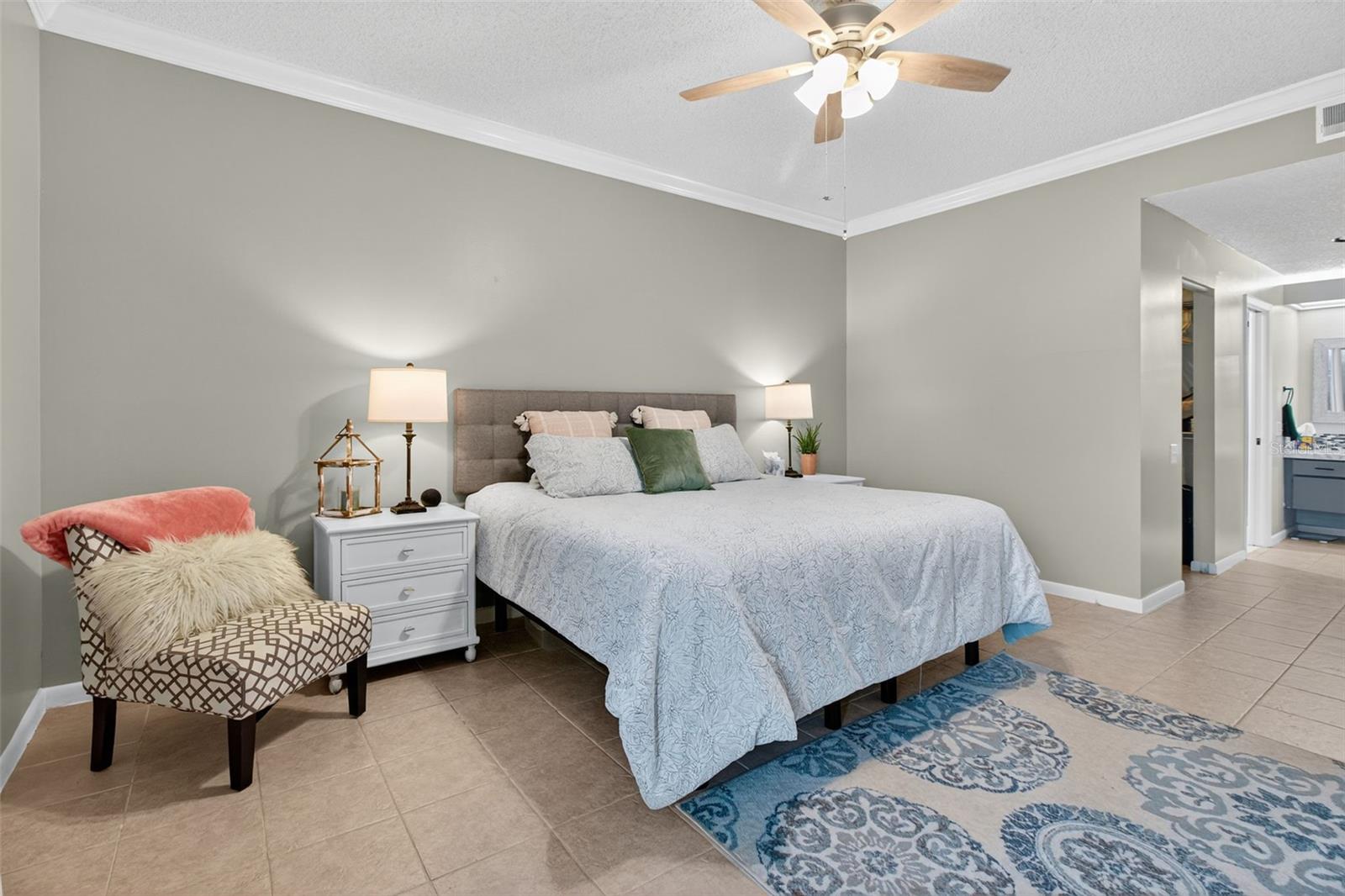 Large primary bedroom with walk in closet and en suite bathroom.