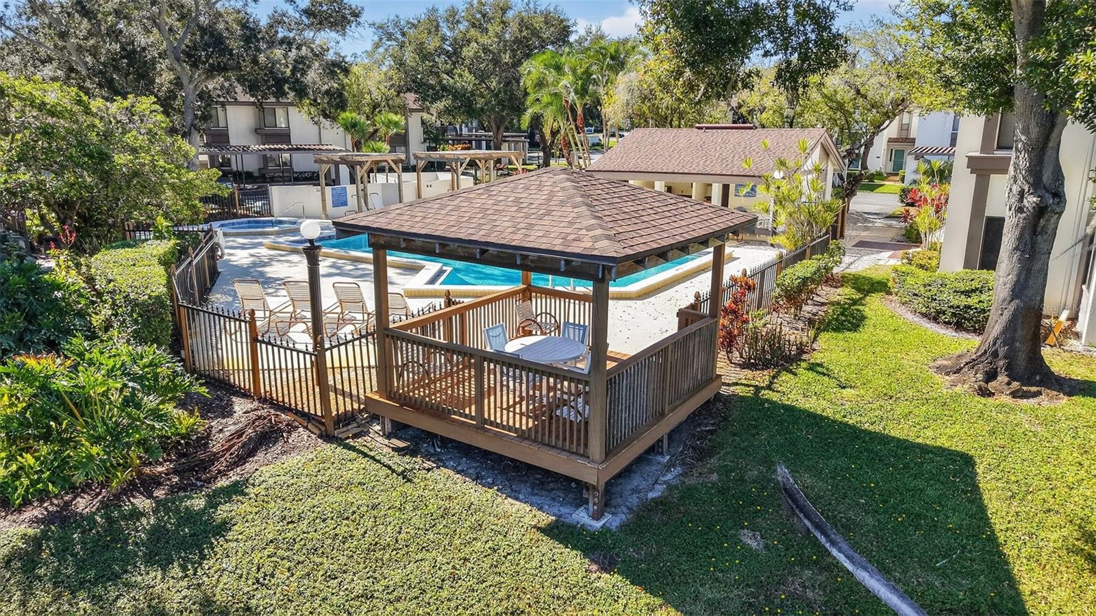 Beautiful heated pool and hot tub area. Just steps away from your villa!