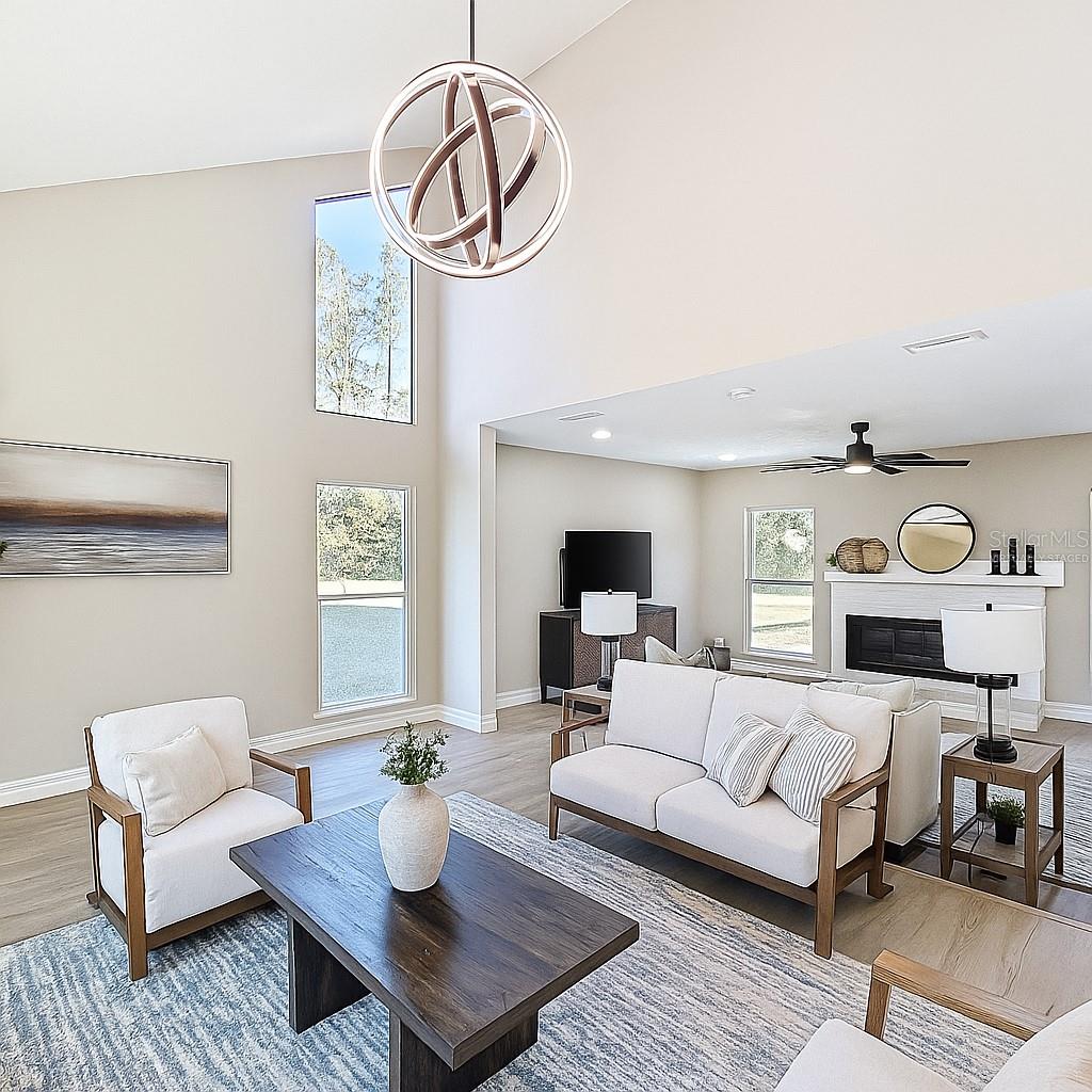 Front living room virtually staged as a living room. Use this space as a huge dining room for holiday gatherings instead. The choice is yours!