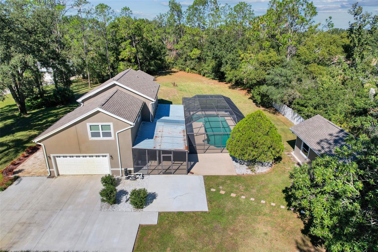 Aerial view of the 1.31 acres. GUEST HOUSE on the right.