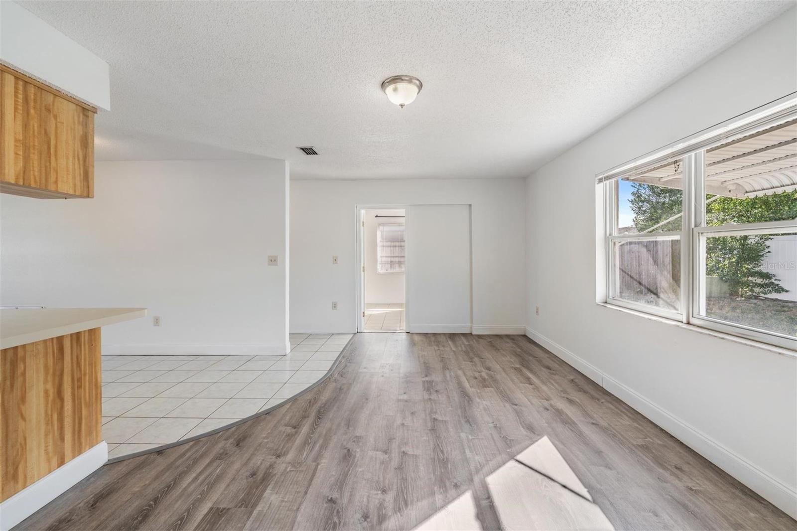 Family room looking into flex room/3rd bedroom.  Hallway to the left leads to bathroom and garage
