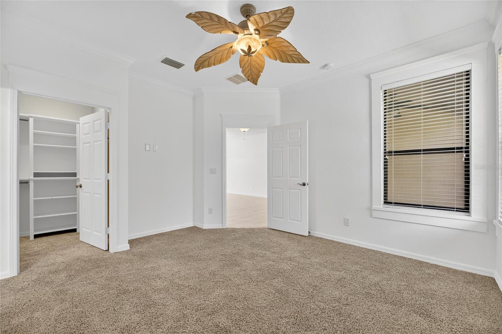 Looking out from the owner's bedroom toward the living room. The oversized closetwith built ins is on the.