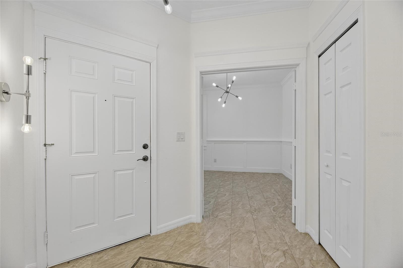 Front door on left, study/den ahead and a bonus-front hall closet on the right!