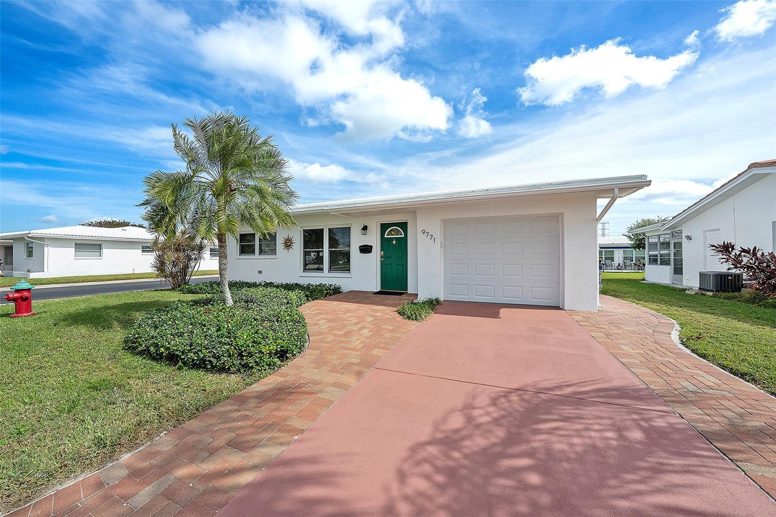 Front of the House with corner view and fire hydrant.