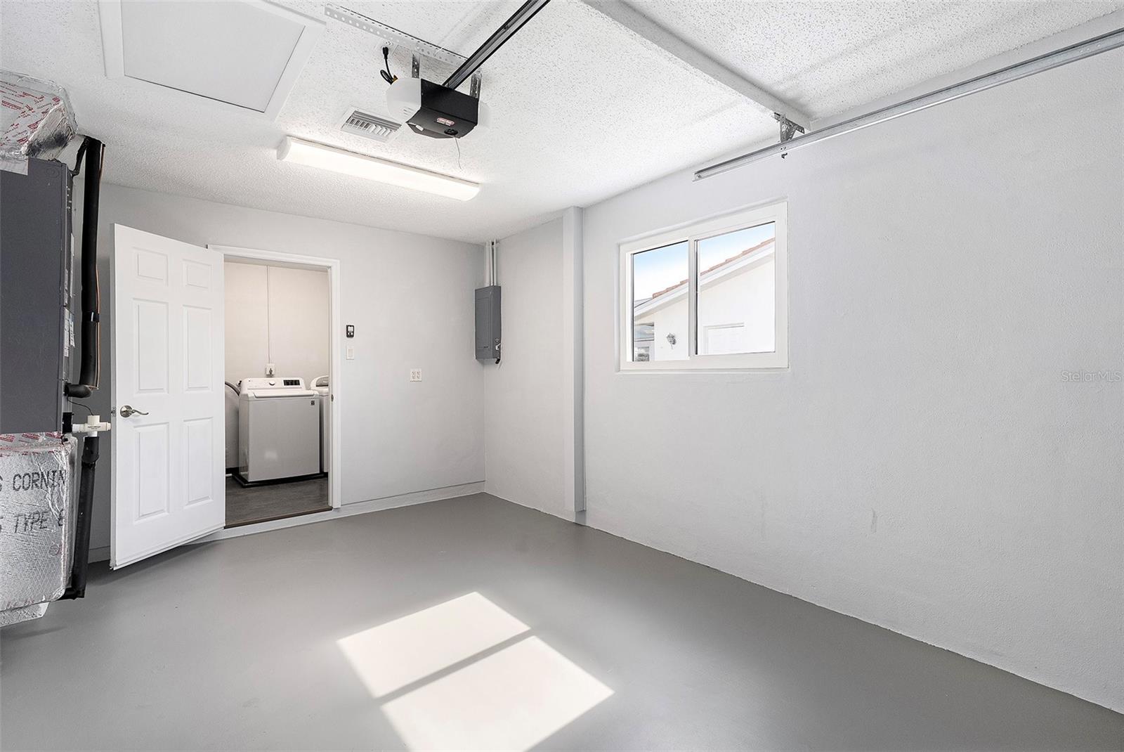 Garage with Lights and AC for workshop or mancave.