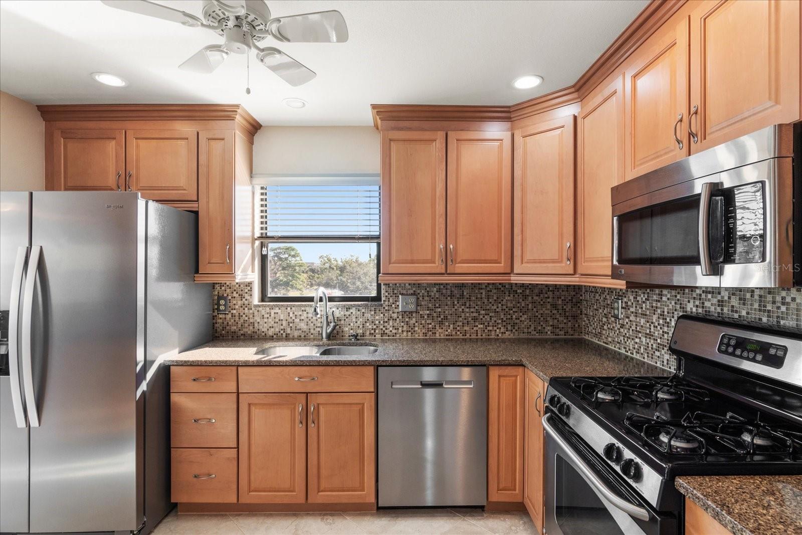 Granite counters, tile backsplash and all stainless appliances.
