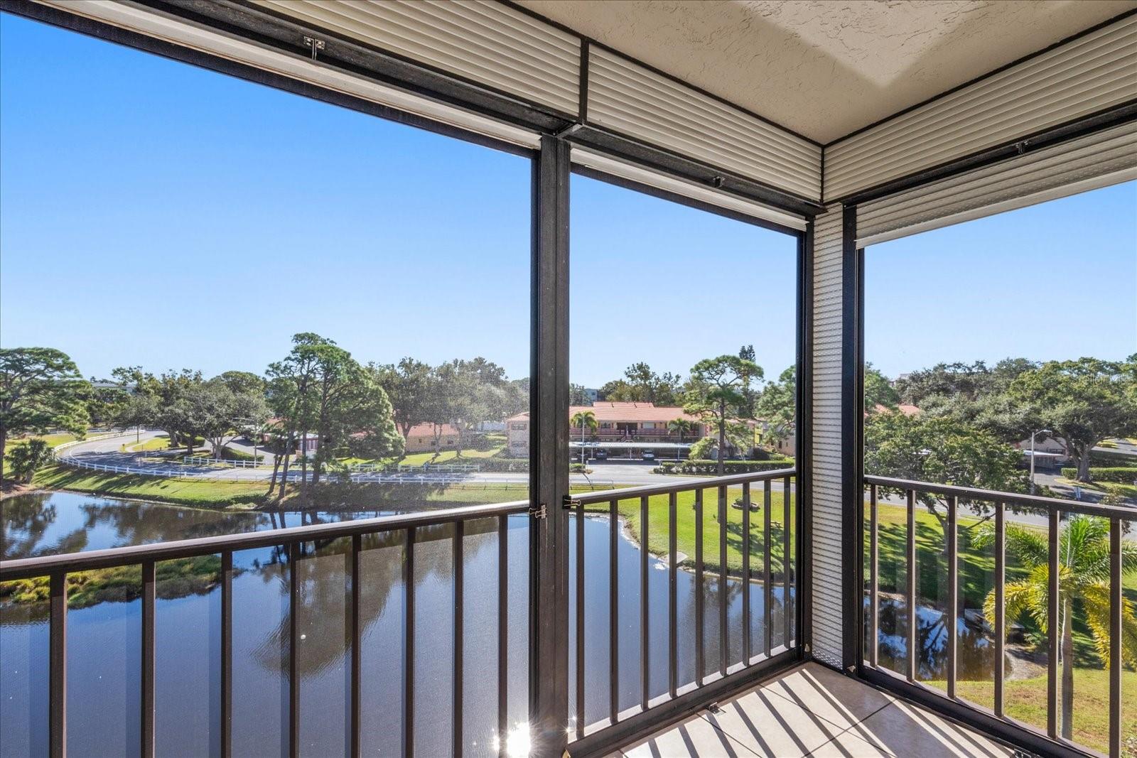 This gorgeous pond with your own screen porch that does have hurricane protection
