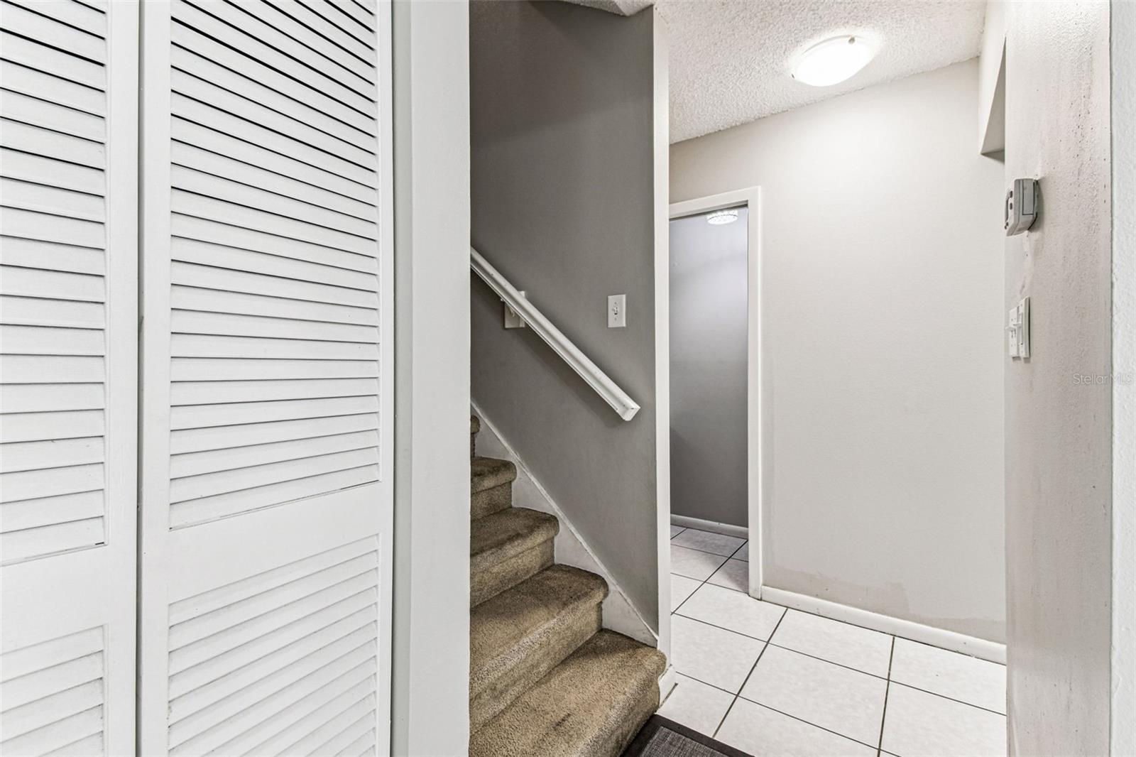 Living room entry to bath and kitchen