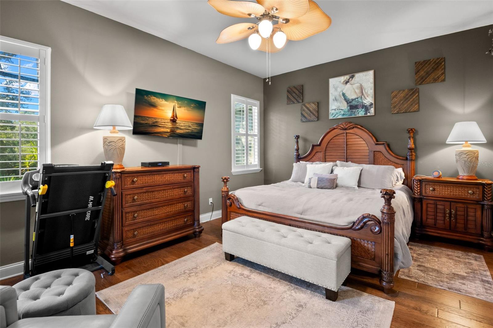 Private primary suite at rear of home