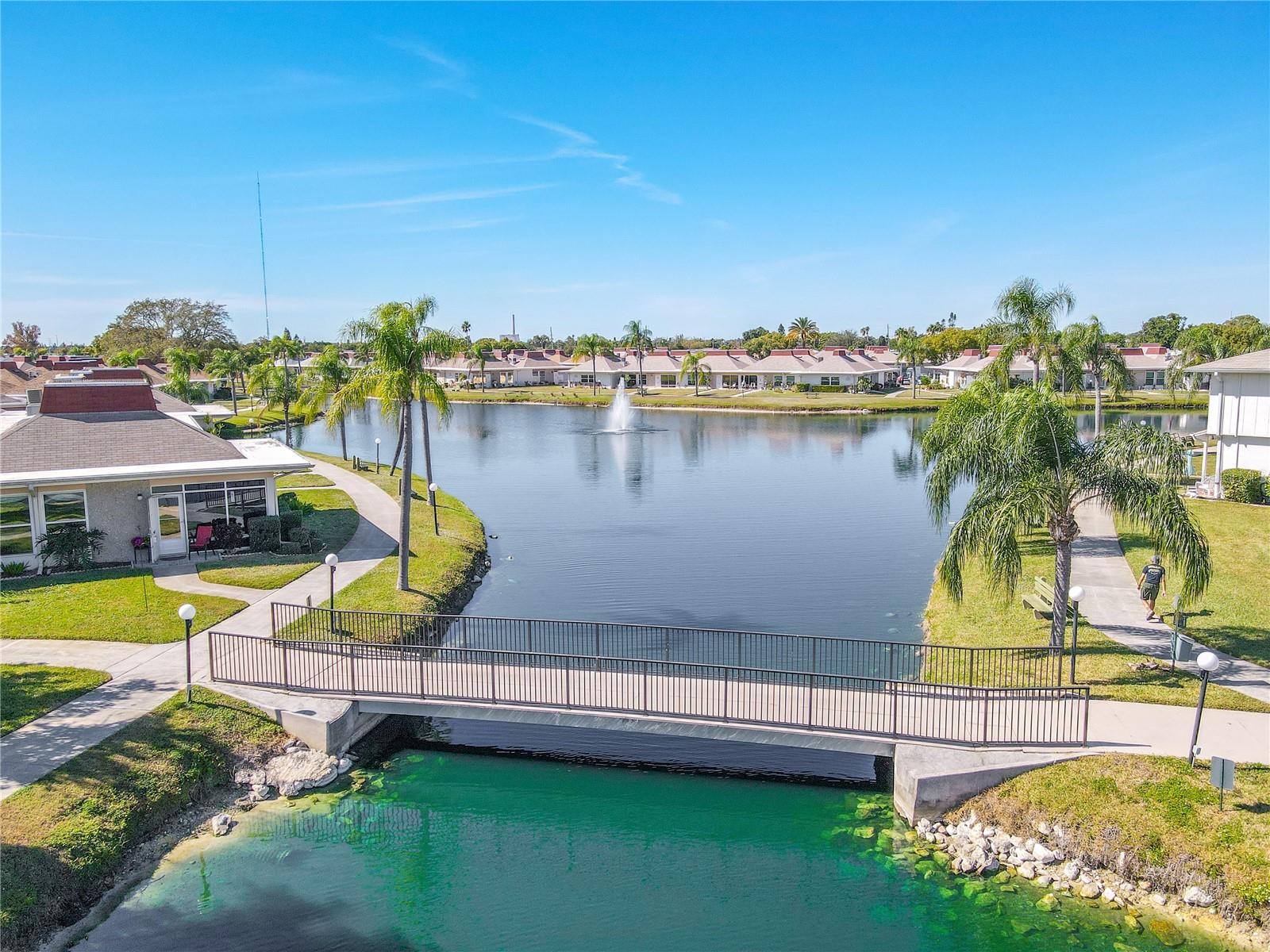 Just look at the close proximity access from your unit making it easy to visit friends across the way. What a beautiful stroll through the scenic landscape of this community.