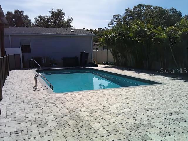 Back of Pool by Fire Pit Looking at Front of Pool Area