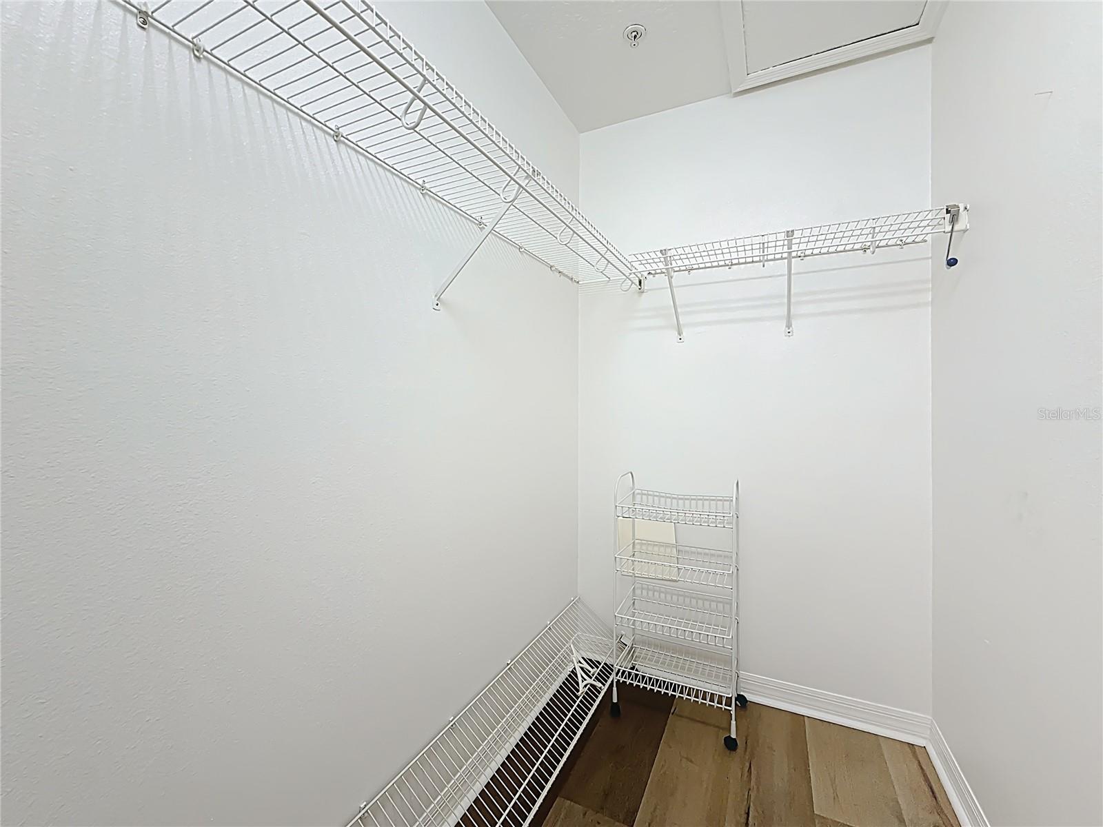 Primary bedroom walk-in closet