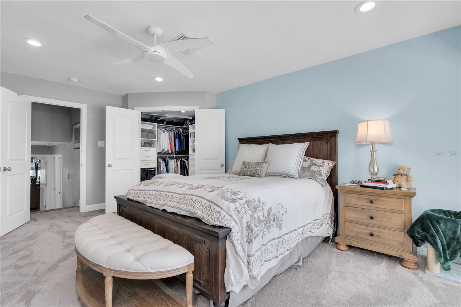 Primary suite with double door entry to custom walk in closet and stunning private bathroom