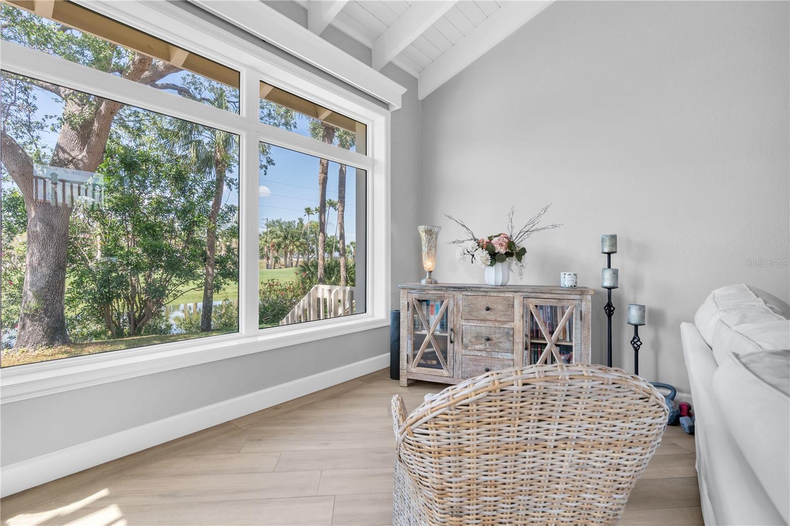 Main living area features custom hurricane rated picture windows.  The space is flexible, and can easily accommodate dining area