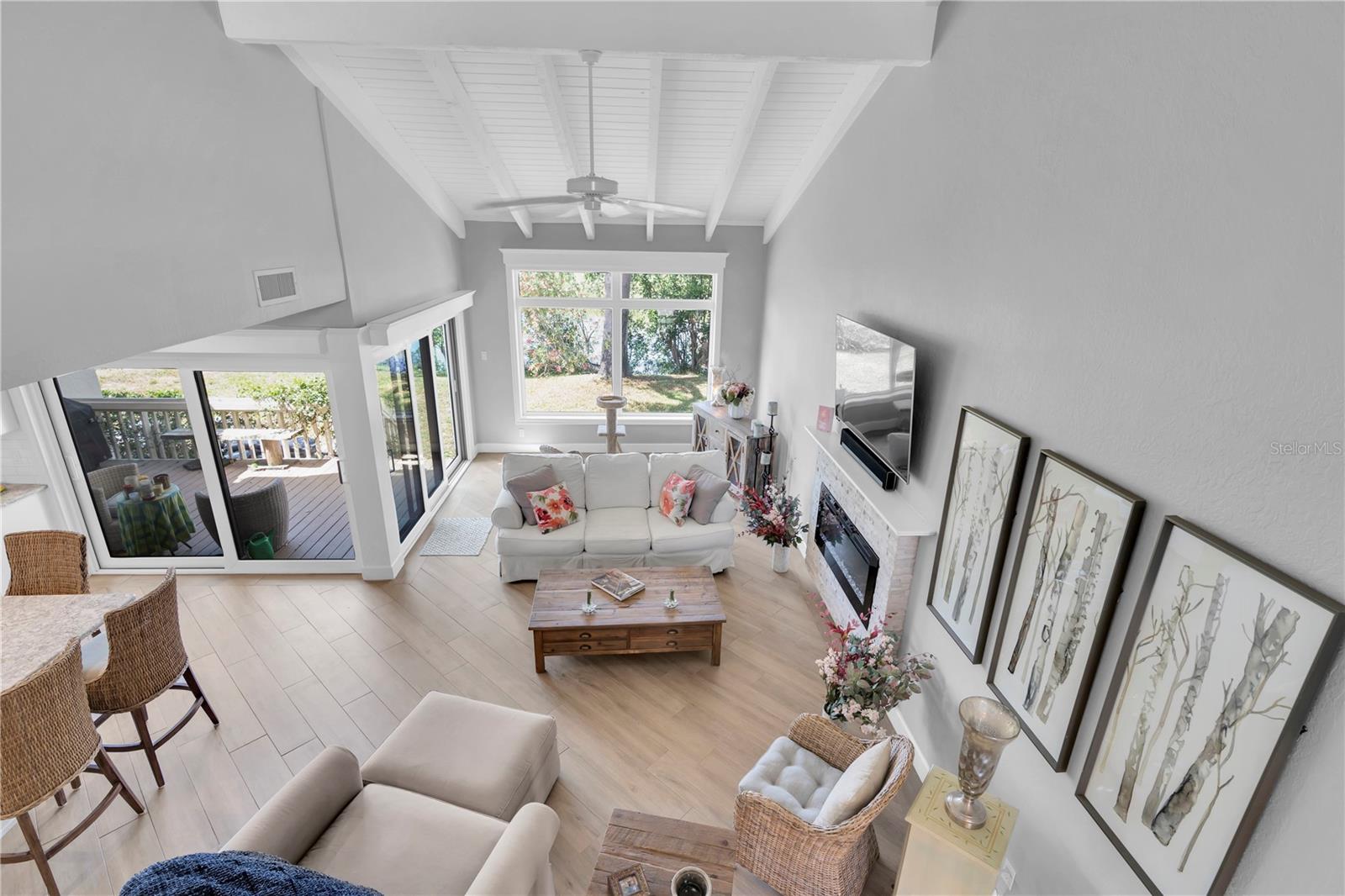 Double sliding glass doors are hurricane rated and lead to the private deck