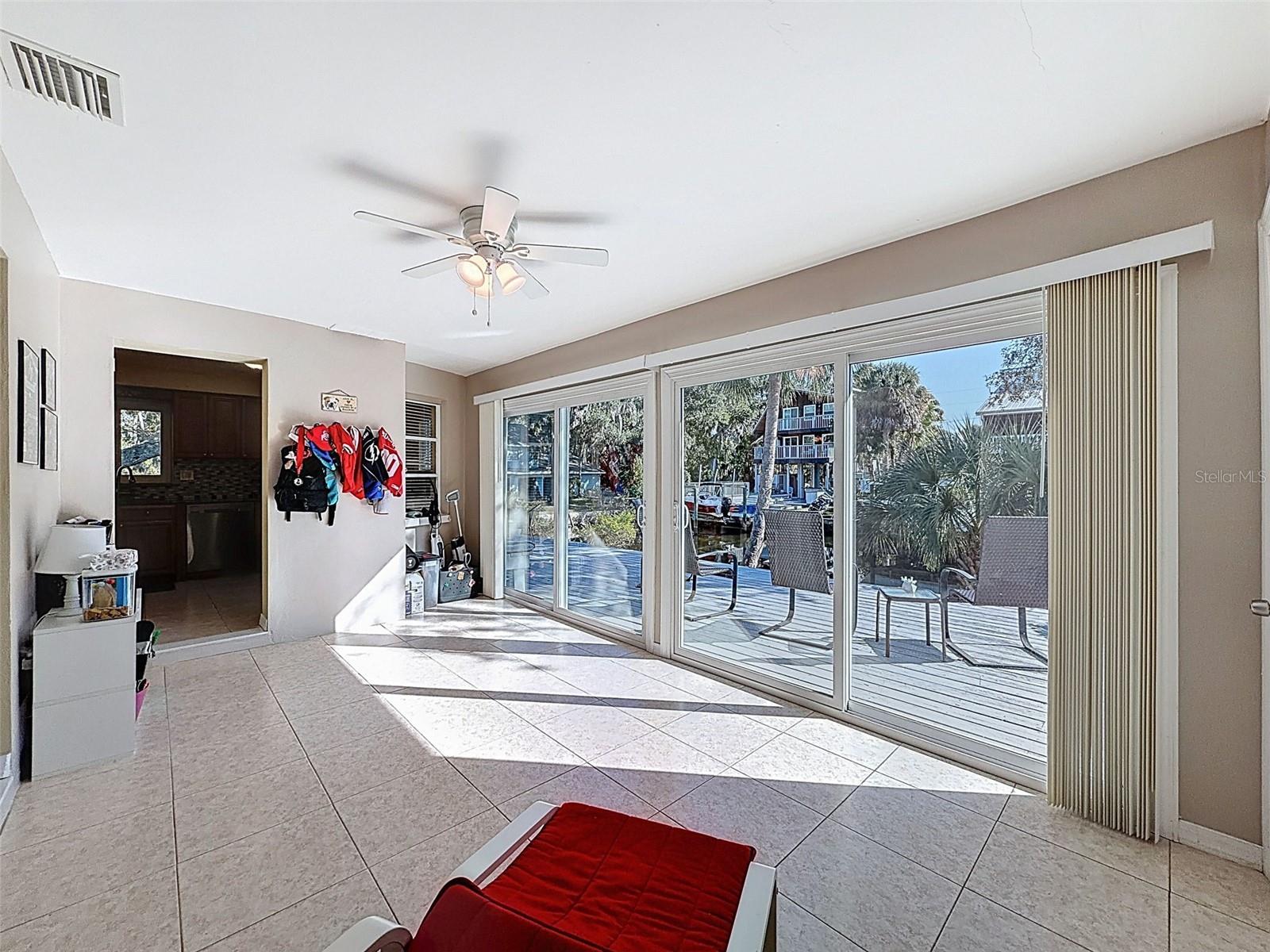 Florida room with sliding doors to the huge outside deck