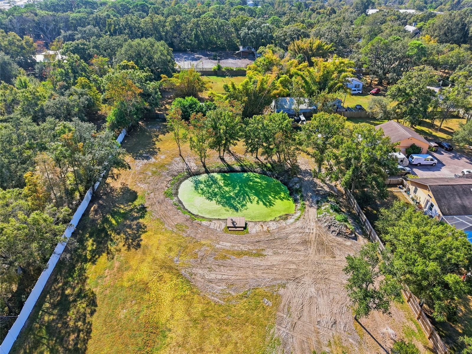 Pond at the rear of property with a dock.