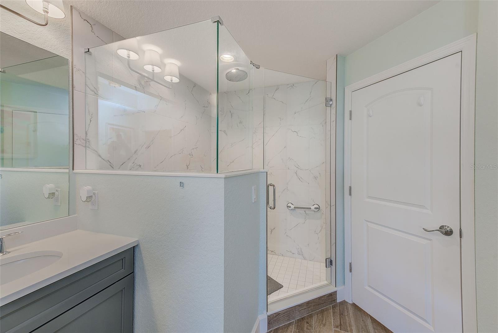 Primary Bath offers large shower with beautiful tile detailing
