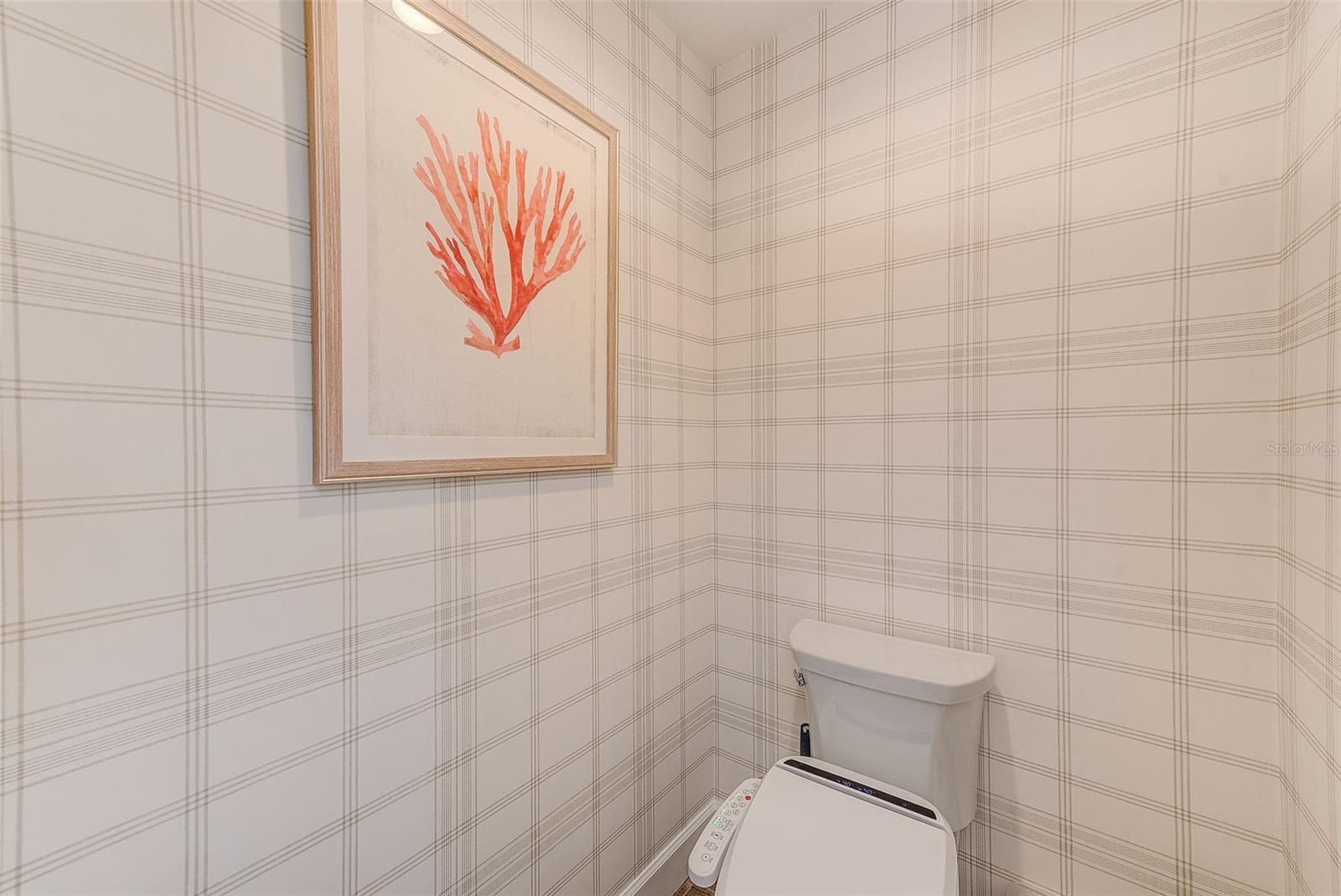 Primary Bath: separate water closet has beautiful plaid wallpaper