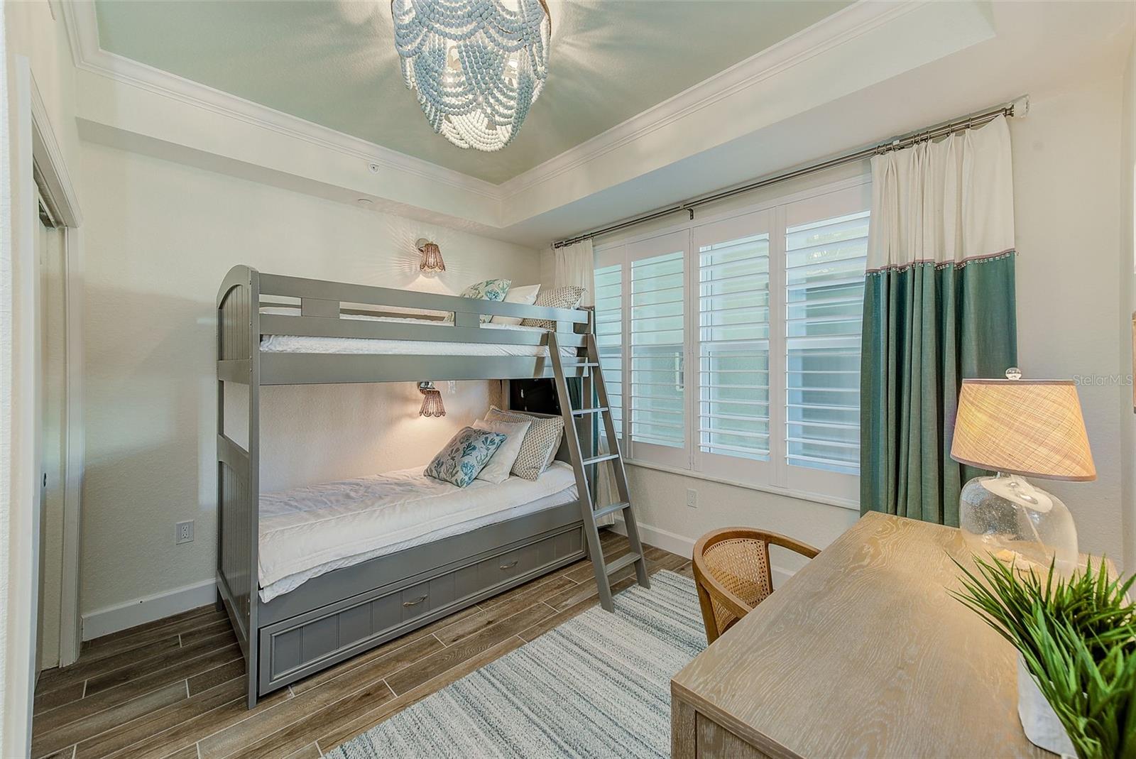 3rd Bedroom/Office finished with a coffered ceiling and custom window treatments.
