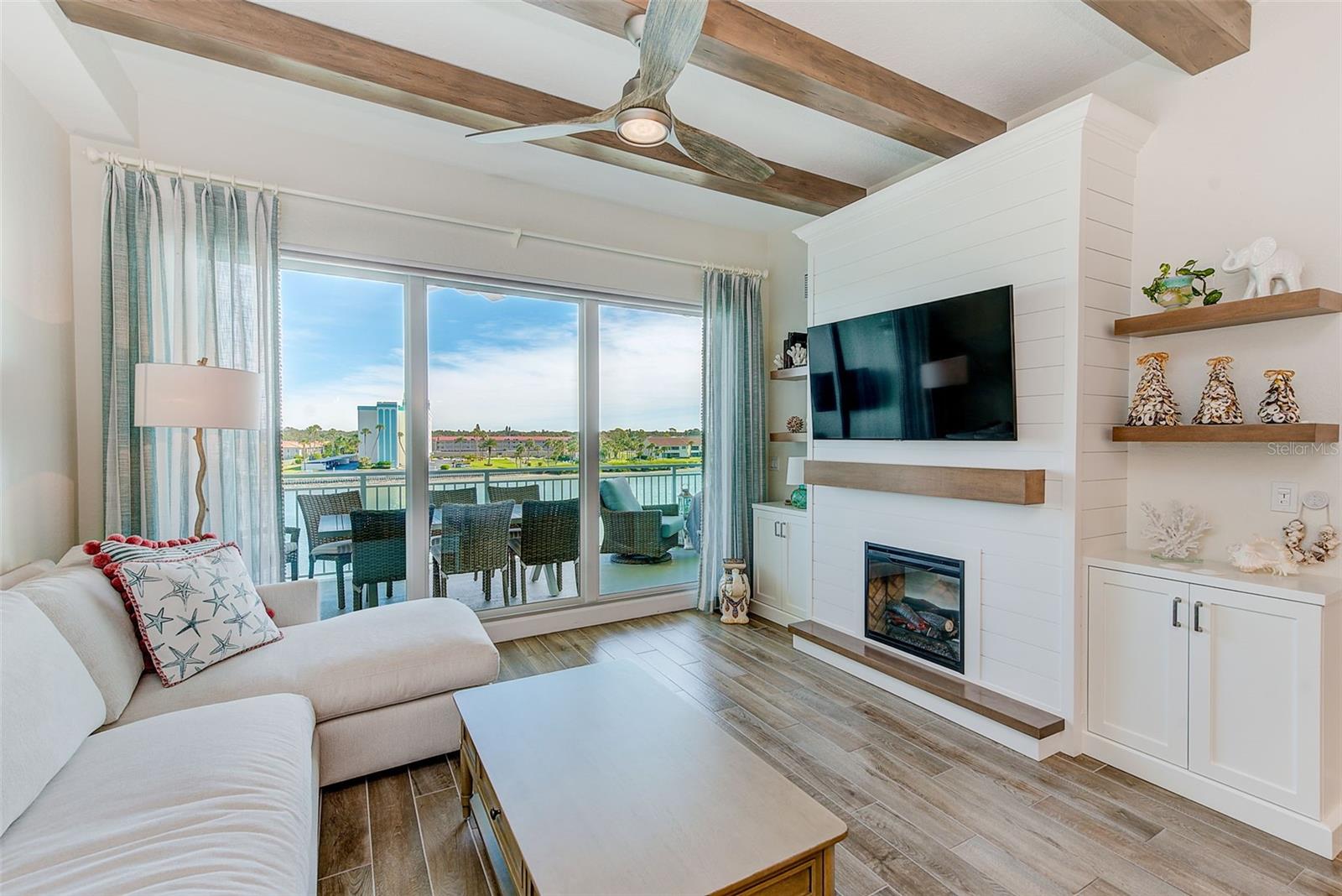 Fireplace wall with shiplap and custom built in cabinetry