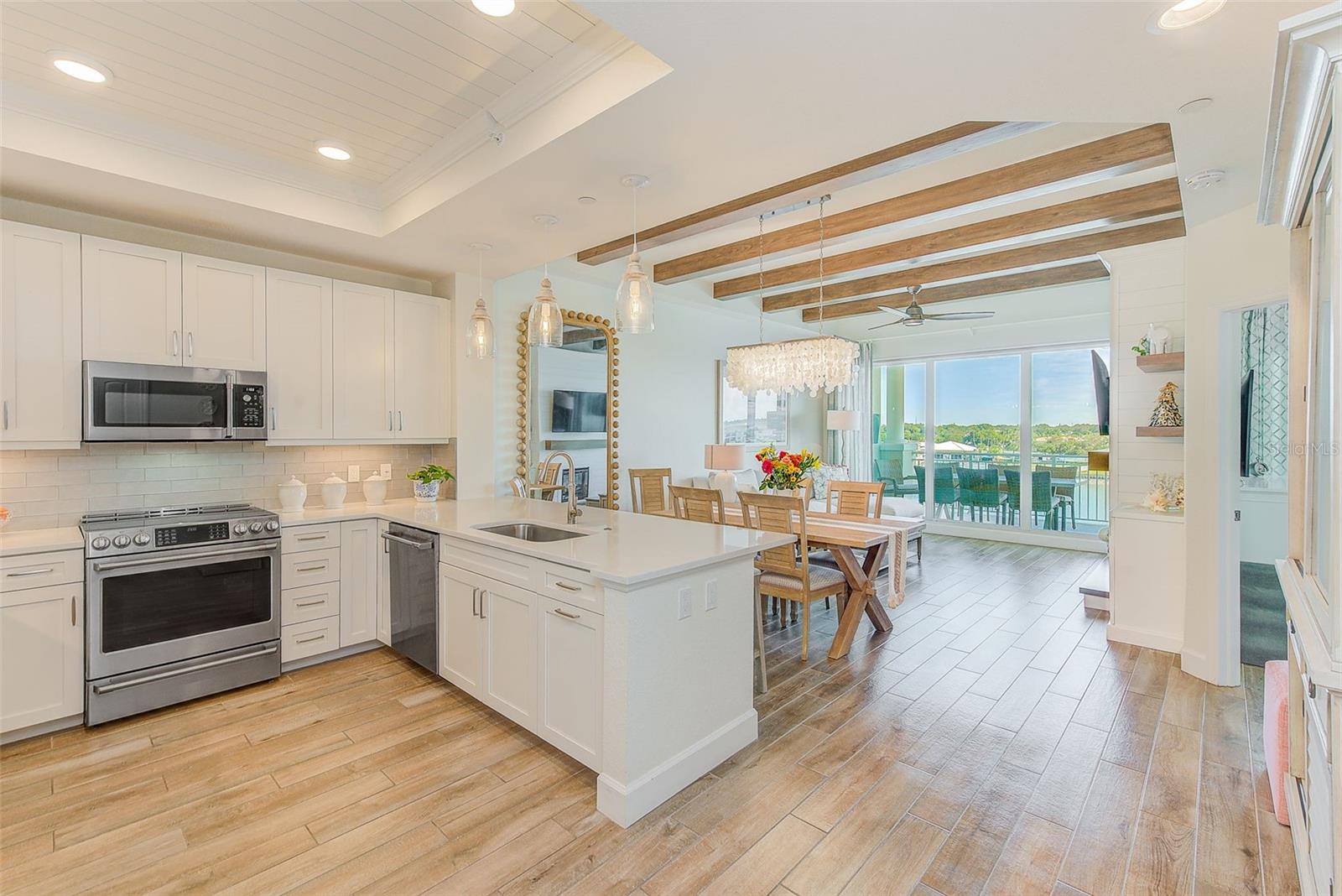 Wood plank tile flooring throughout for easy maintenance