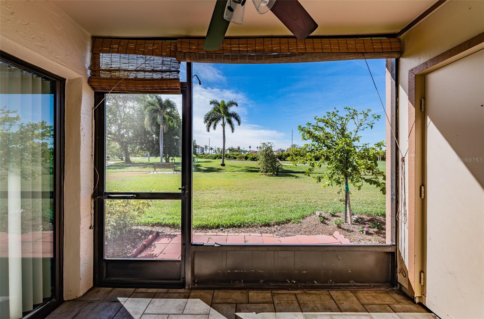 Private Screened Patio overlooks the Lush Green Golf Course