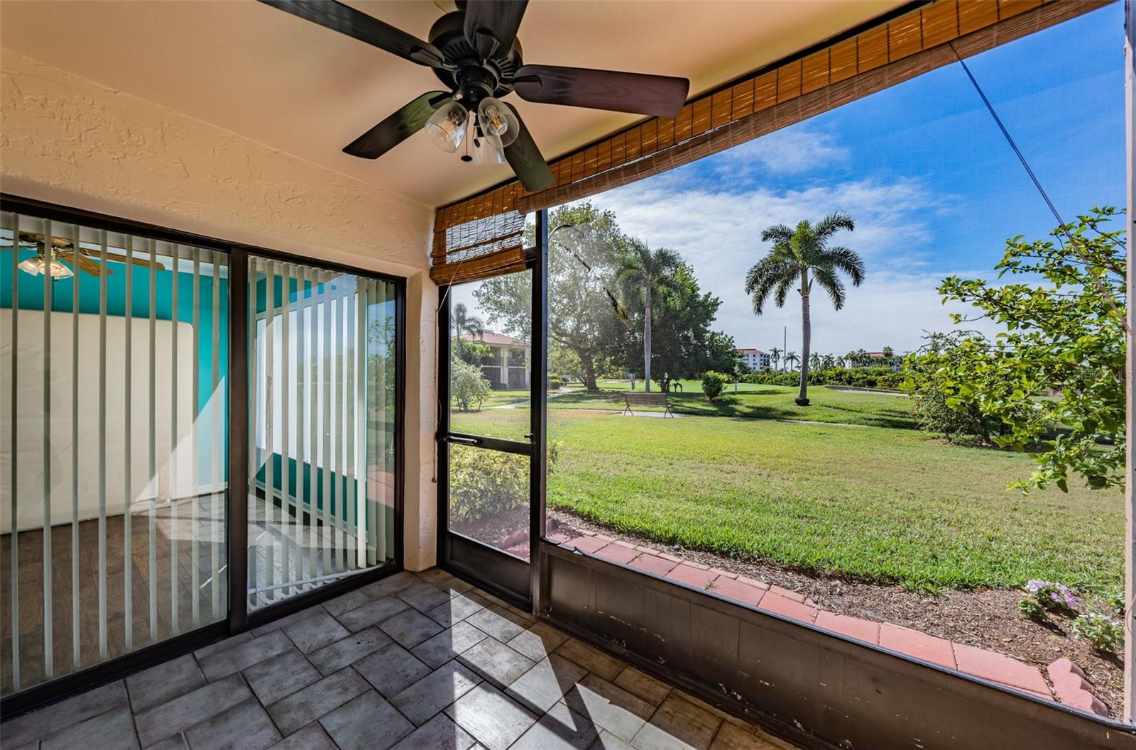 Private Screened Patio overlooks the Lush Green Golf Course
